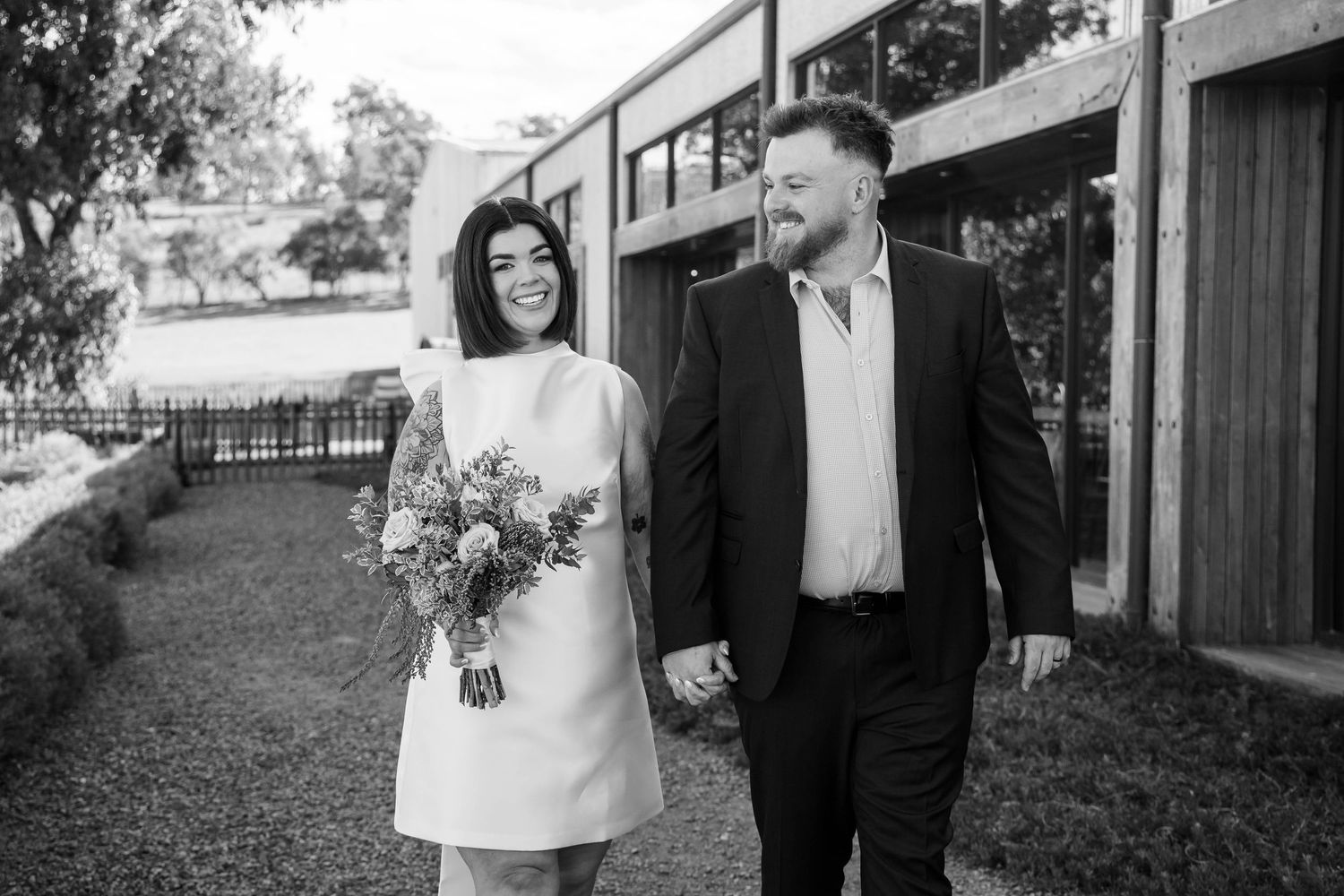 A wedding photography collage showing black and white moments captured throughout an elegant outdoor ceremony and reception.