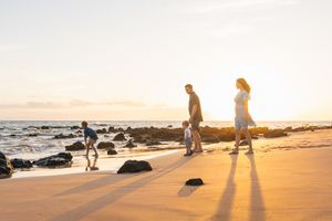 Maui family photographer photo against beautiful Maui sunset beach by ohwowfotos.