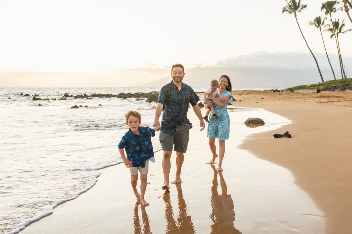 Maui family photographer photo against beautiful Maui sunset beach by ohwowfotos.
