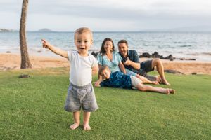 Maui family photographer photo against beautiful Maui sunset beach by ohwowfotos.