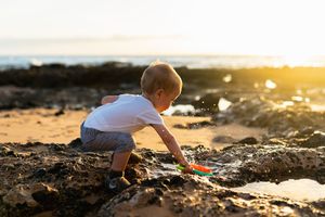 Maui family photographer photo against beautiful Maui sunset beach by ohwowfotos.