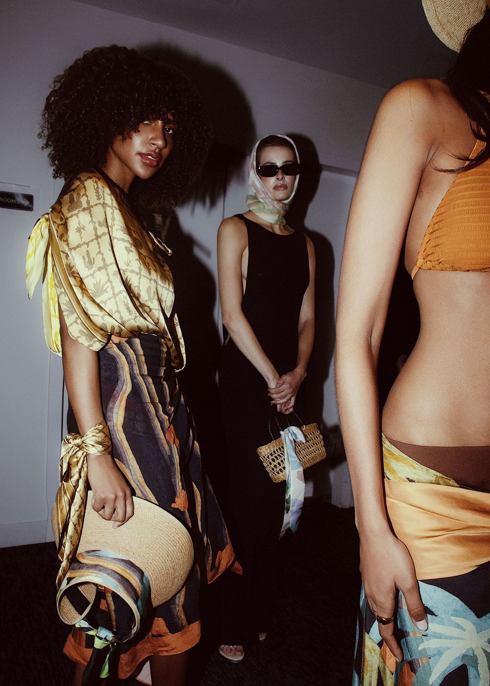 Artistic fashion photography series showing models in casual wear against dramatic shadows and lighting.