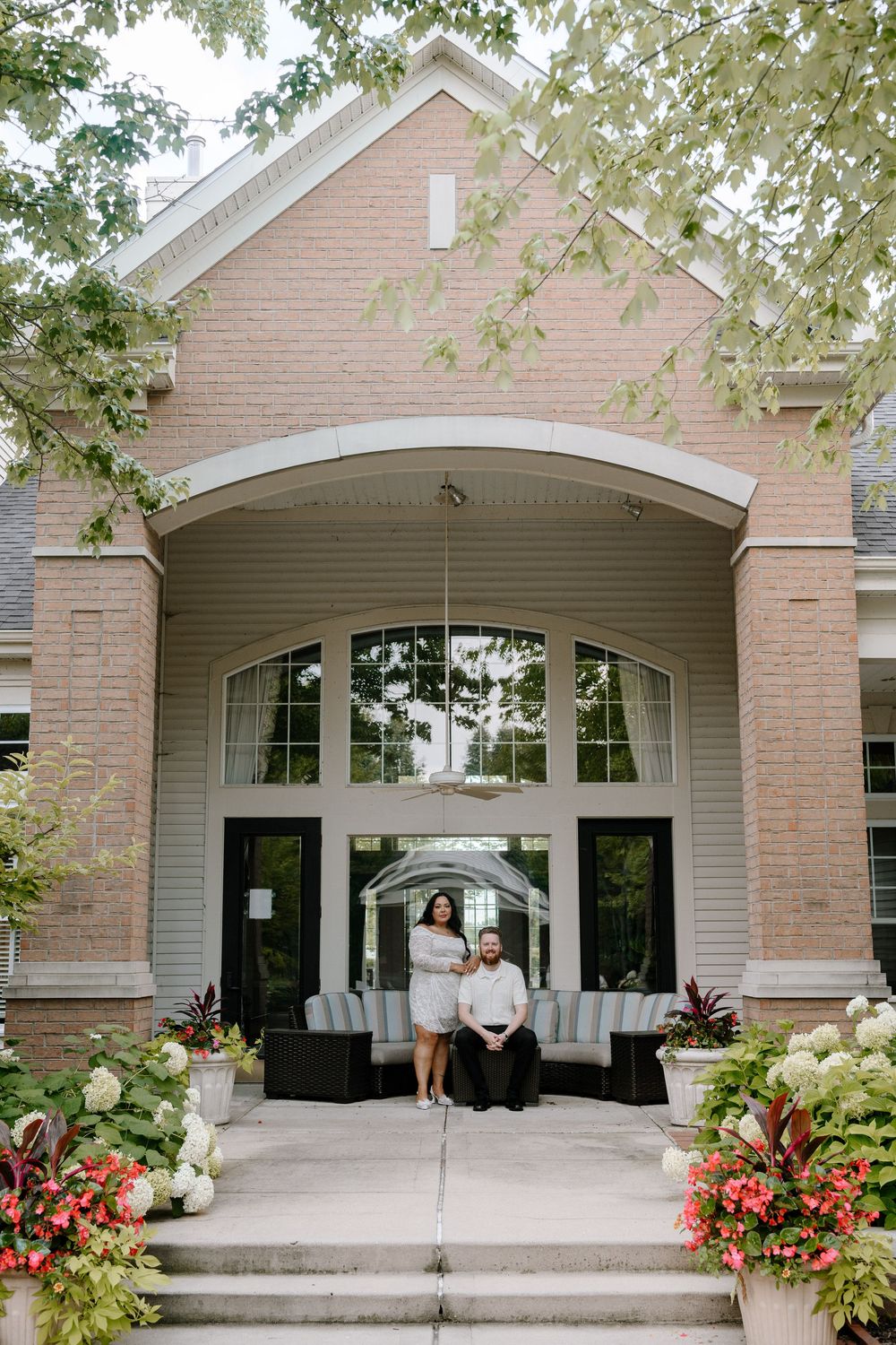 A sequence of photos showing an elegant brick building entrance with white trim and colorful garden flowers.