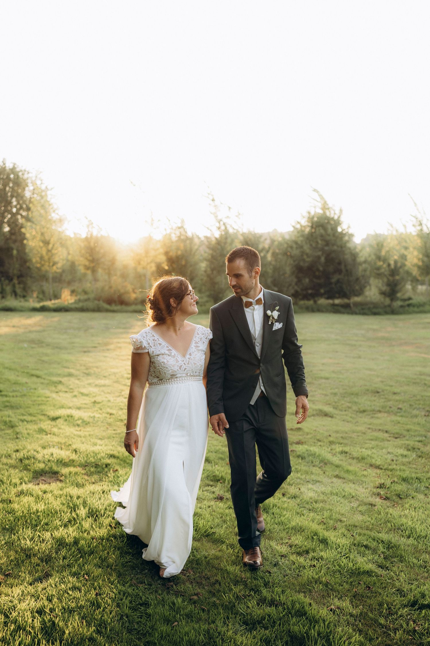 A tender autumn embrace captured during a wedding photoshoot with fall foliage.