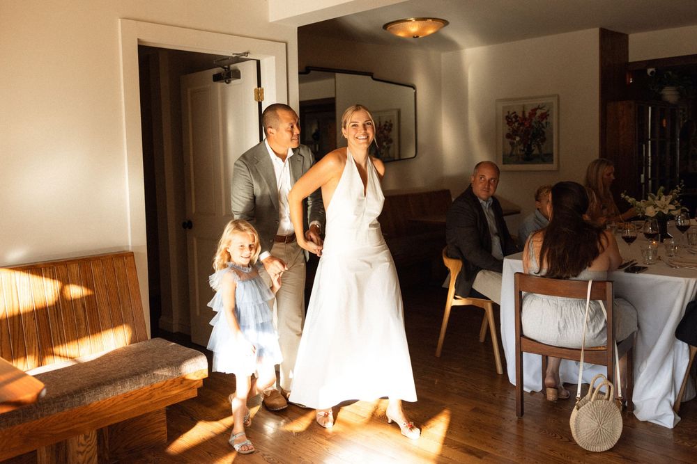 Sunlit indoor wedding venue with elegant furniture and natural lighting.