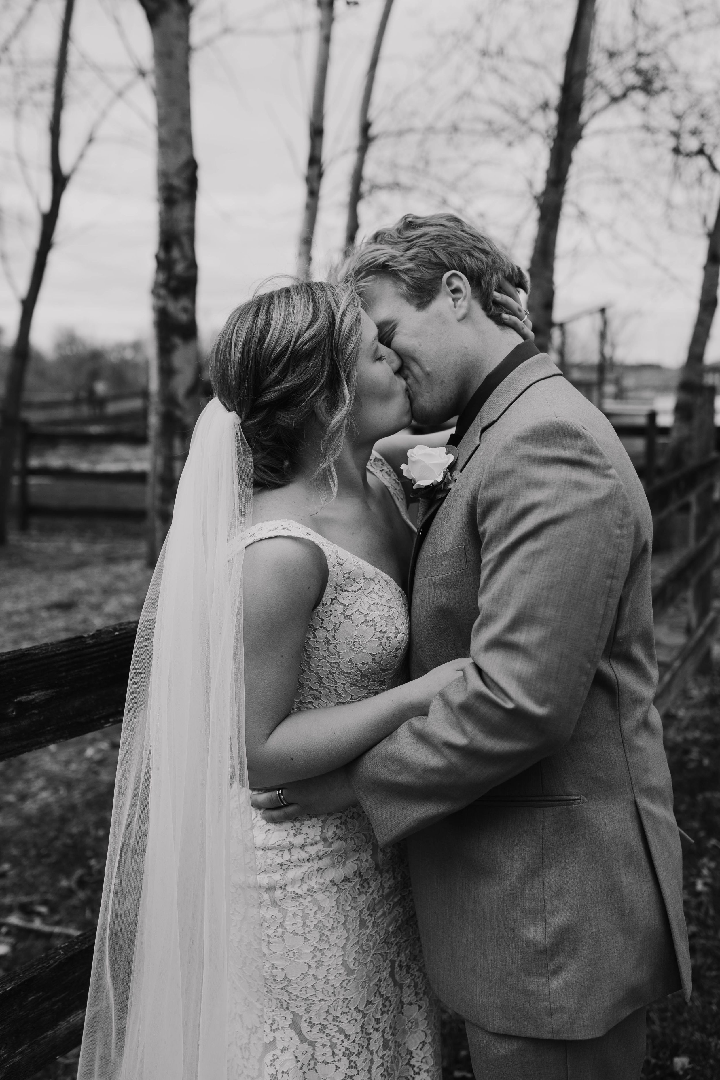 Black and white wedding photography capturing intimate moments between newlyweds.
