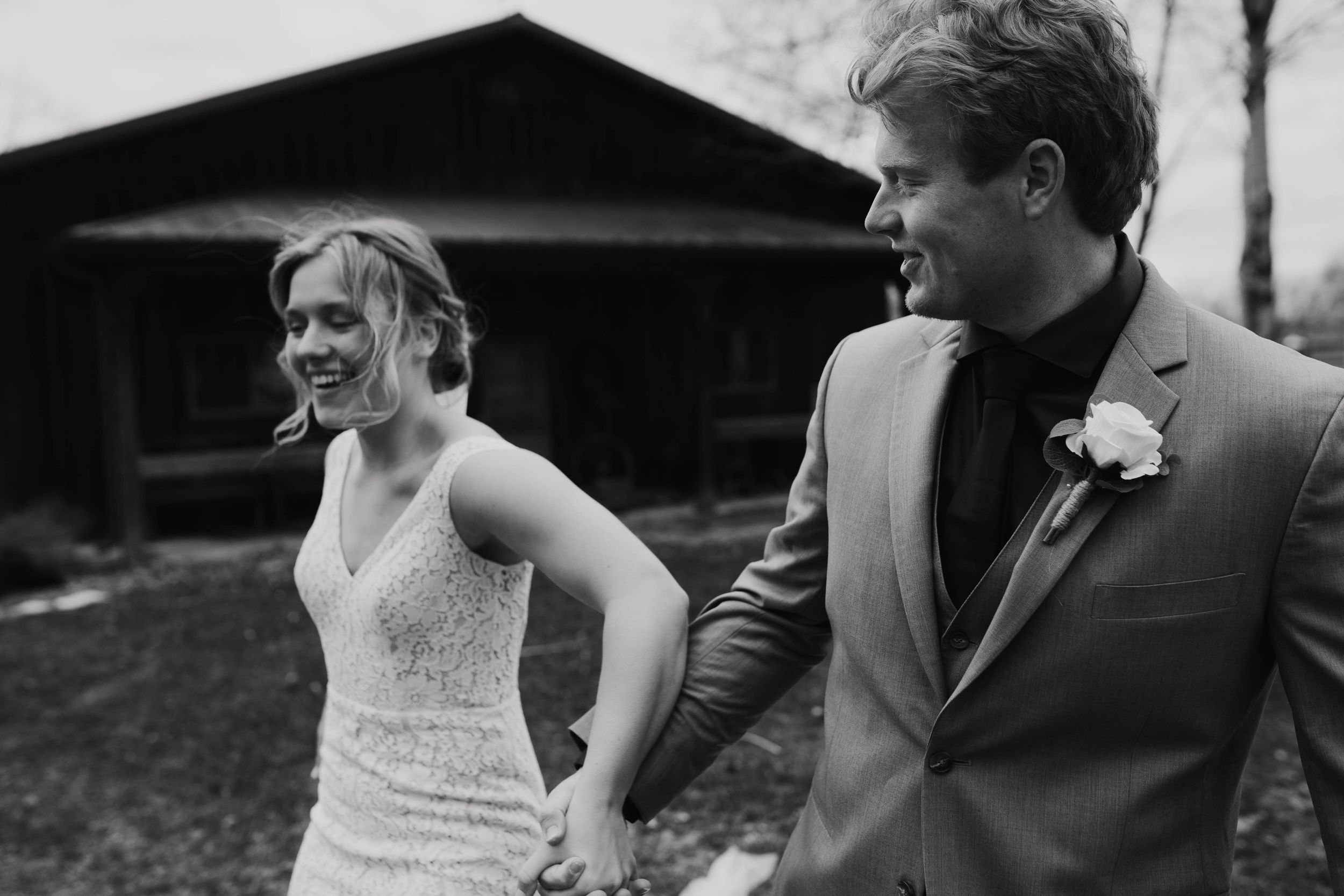 Candid wedding photography showing emotional reactions during outdoor ceremony.