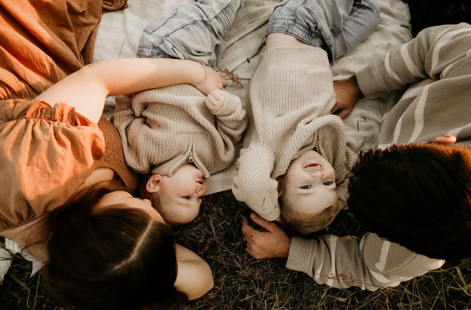 Family photos outside on a blanket
