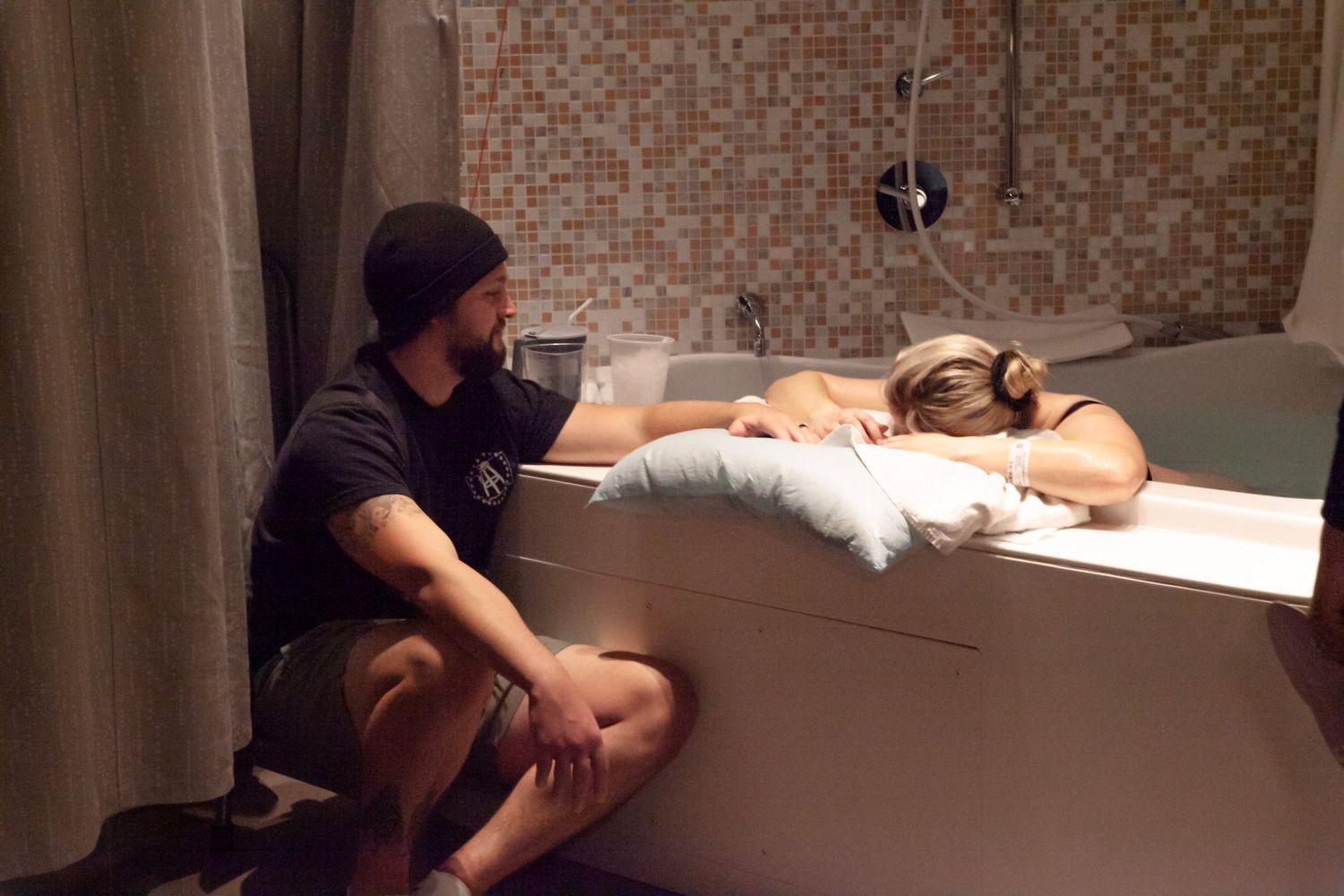 Husband and wife focusing on labor during their birth journey.