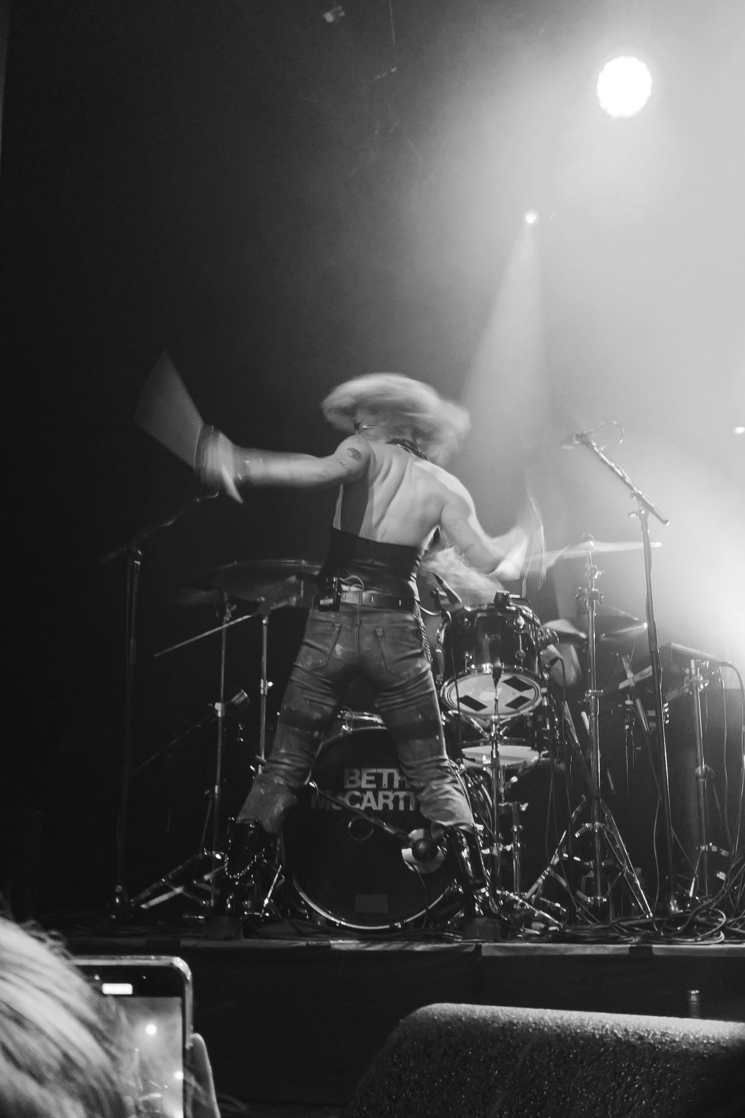 Black and white concert photography of Beth McCarthy playing drums with her drummer at the columbia theater in Berlin, Germany