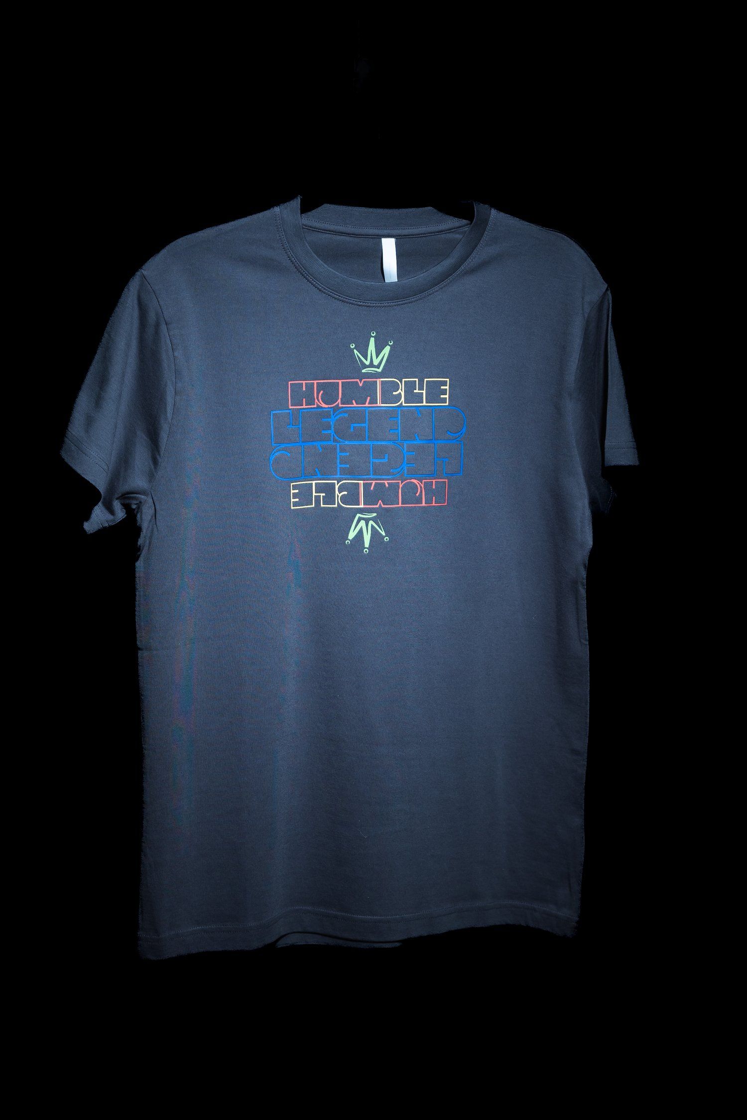 Navy blue t-shirt with Humble Legend graphic design displayed on dark background.