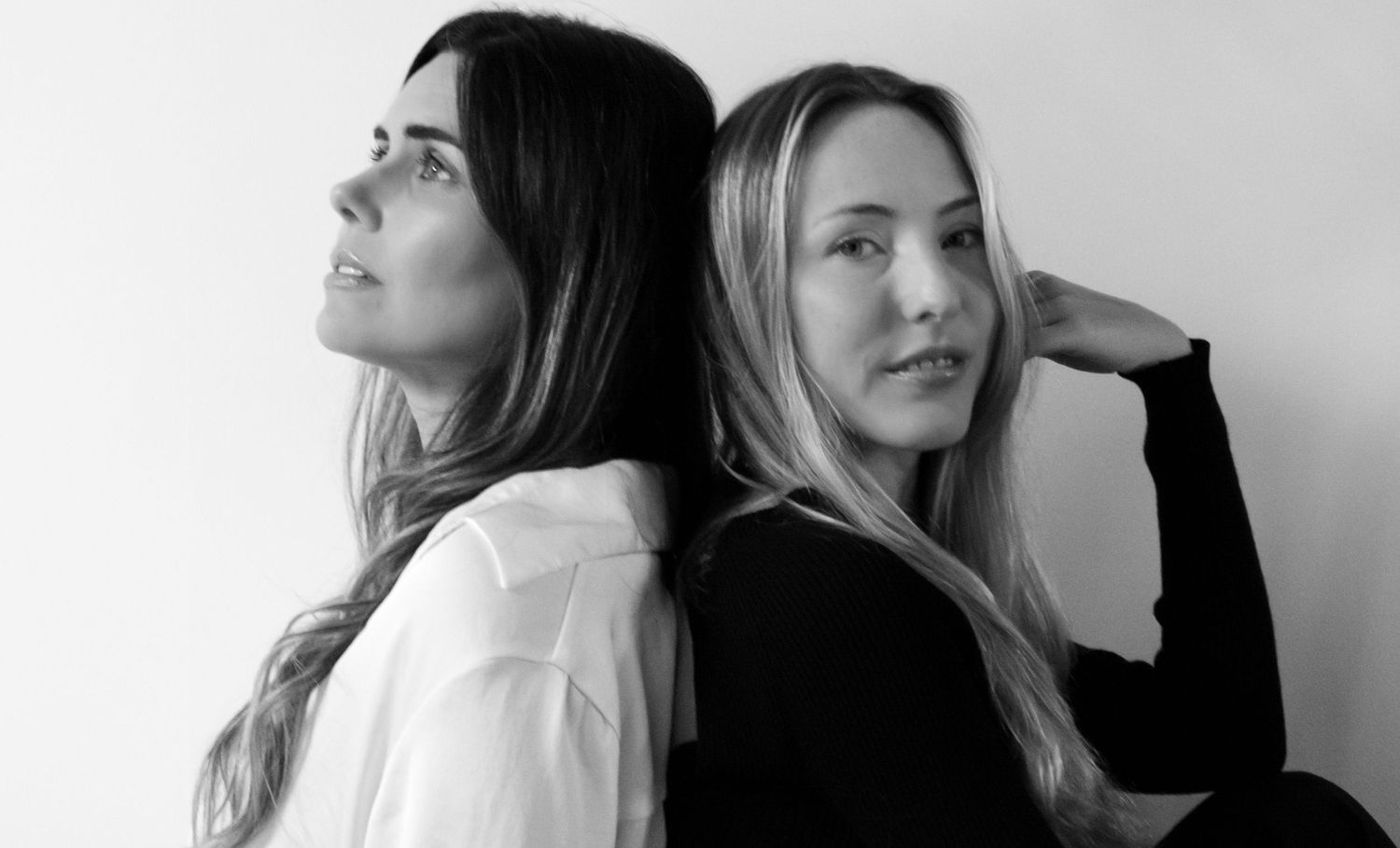 Artistic black and white headshots showing models looking in different directions.