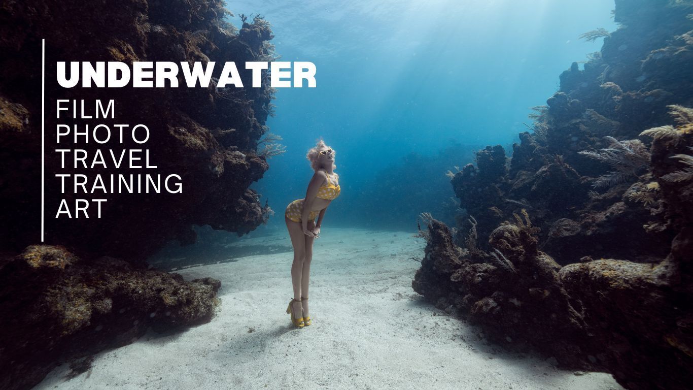 A serene underwater scene with coral reefs and marine life in crystal clear blue water lit by natural sunlight.