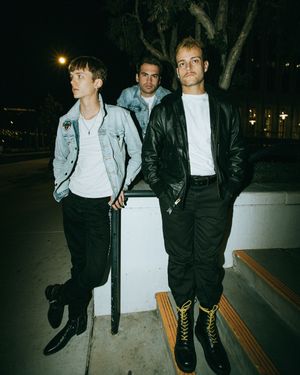People sitting on a wooden bench at night in casual clothing, captured in a series of candid film-style photos.