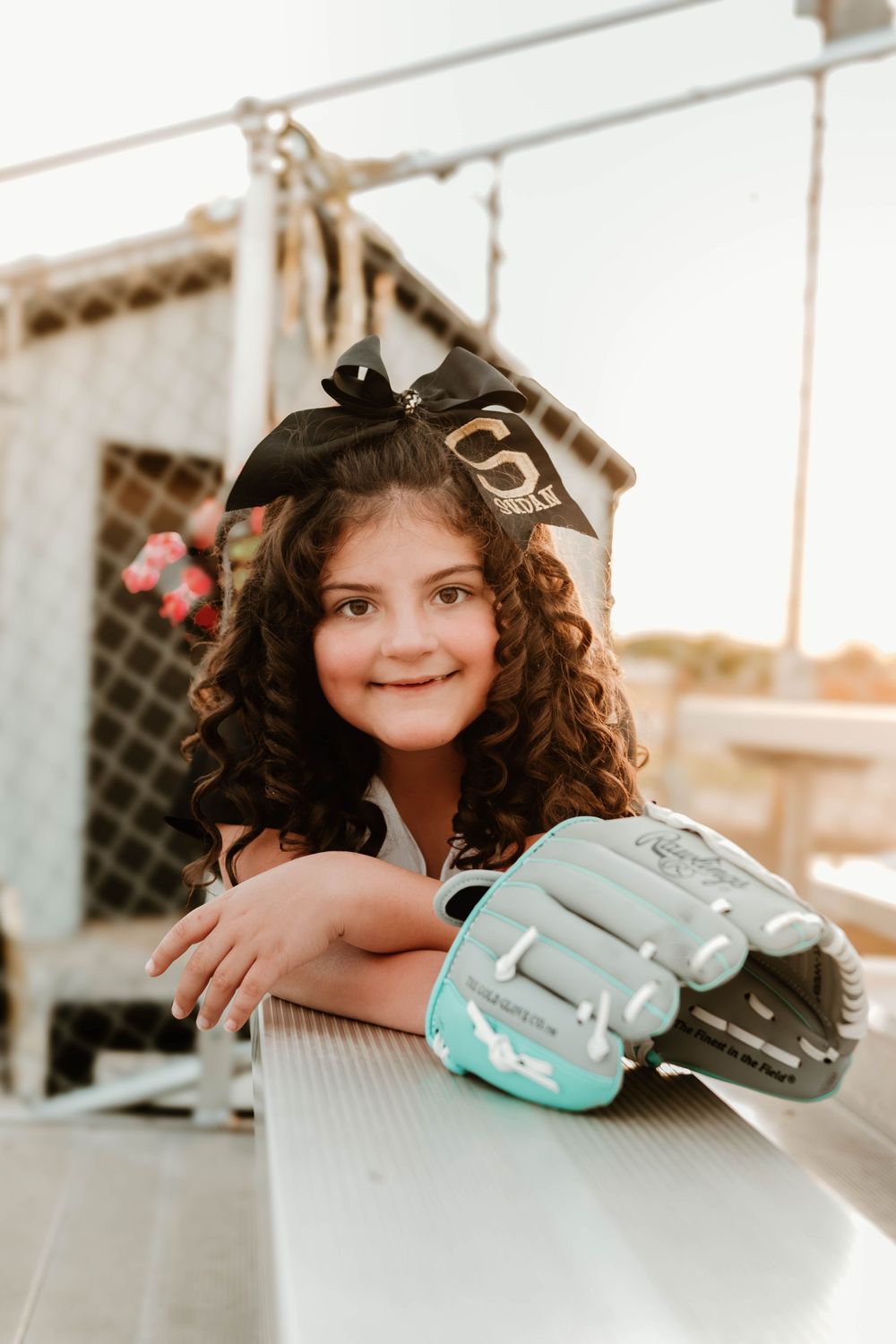 Baseball glove and equipment arranged for a sports-themed photo shoot.