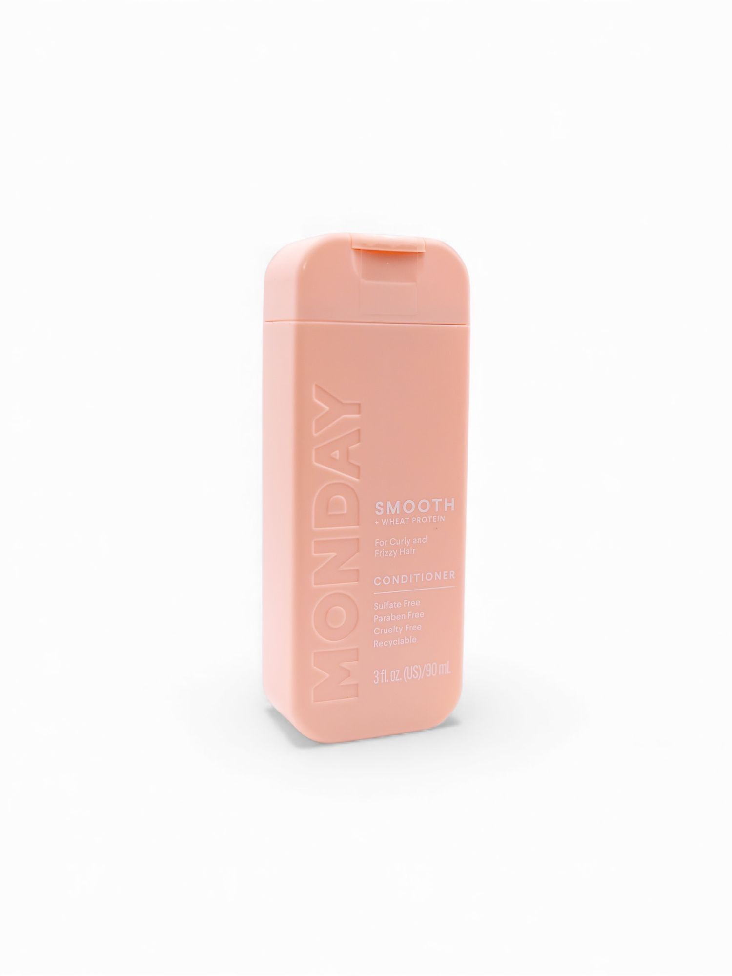 Pink cosmetic containers arranged on neutral background with soft lighting.