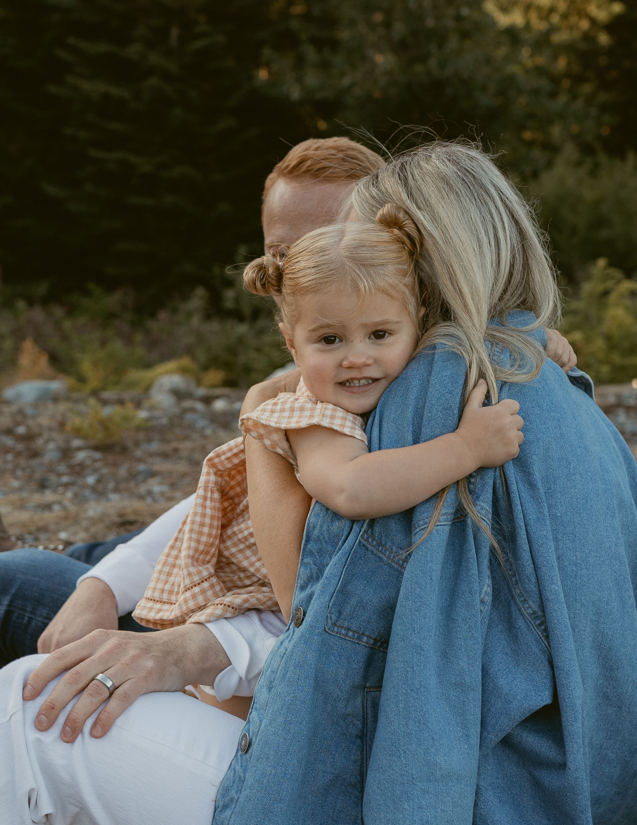 A heartwarming sequence of tender embraces between a parent and child on a sunny autumn afternoon.