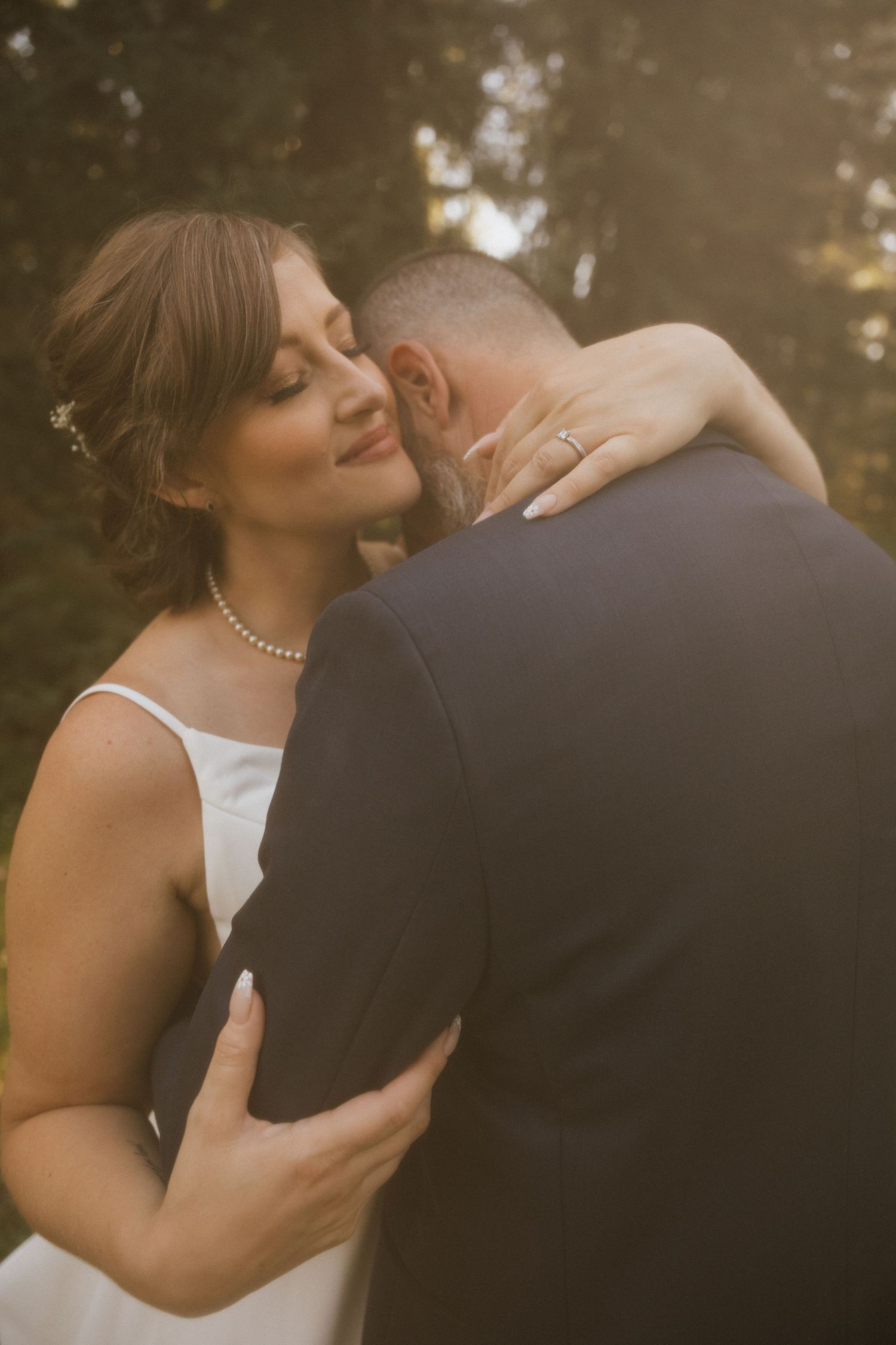 A romantic sunset wedding photo series showing intimate moments between a couple in white dress and black suit.