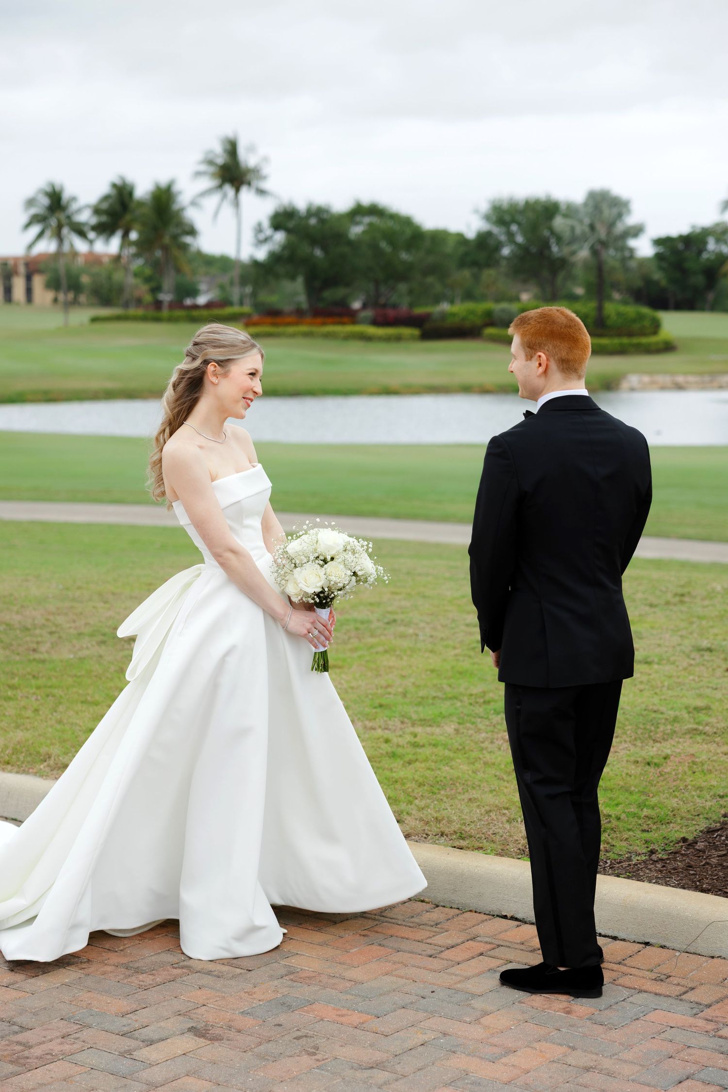 Bride and groom first look at BallenIsles Country Club in Palm Beach, Florida during a wedding photographed by Tom Forrest of Ohio.