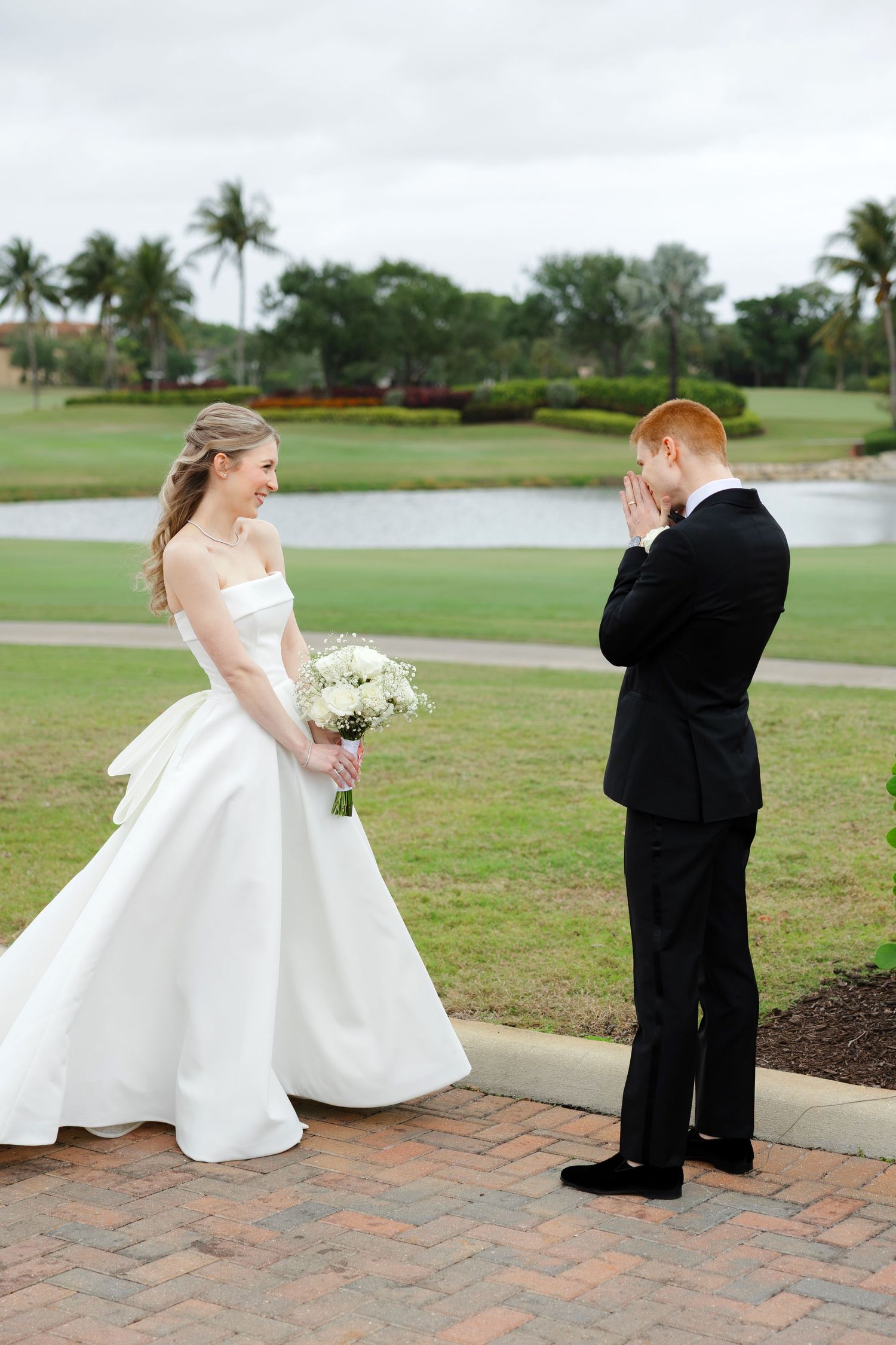 Bride and groom first look at BallenIsles Country Club in Palm Beach, Florida during a wedding photographed by Tom Forrest of Ohio.
