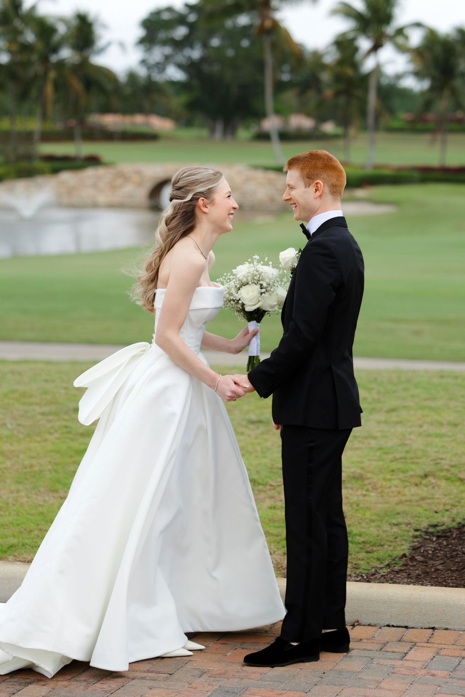 Bride and groom first look at BallenIsles Country Club in Palm Beach, Florida during a wedding photographed by Tom Forrest of Ohio.