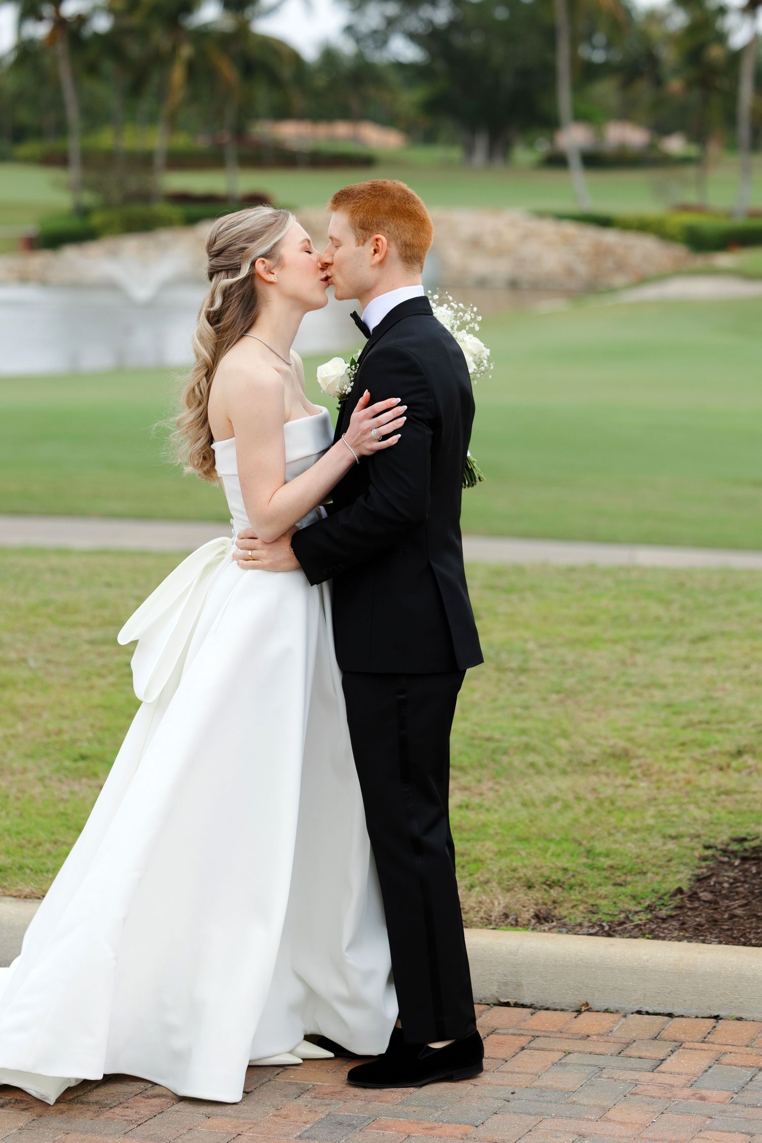 Bride and groom first look at BallenIsles Country Club in Palm Beach, Florida during a wedding photographed by Tom Forrest of Ohio.