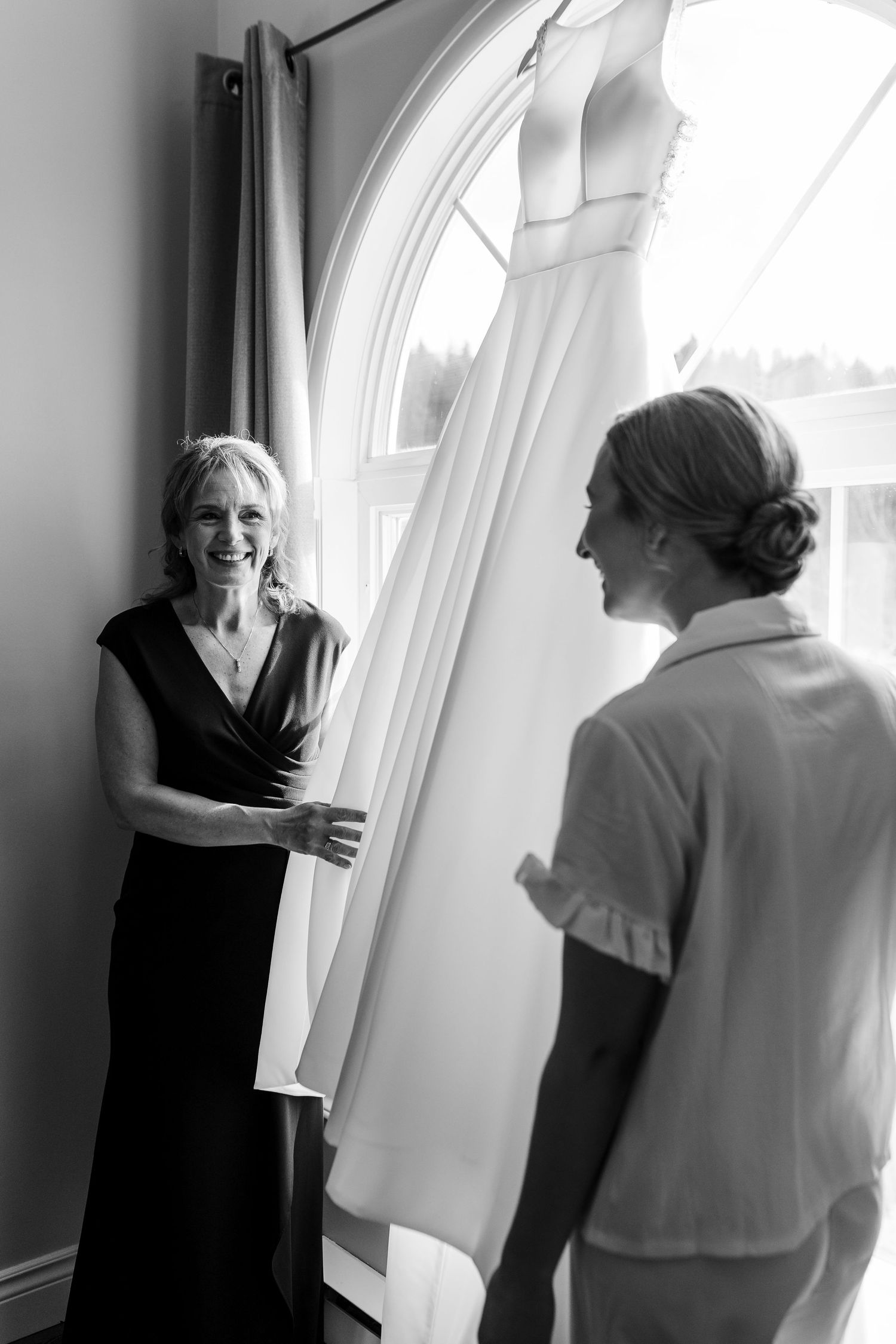 A black and white photo sequence showing a person in dark clothing interacting with someone in white near a window.