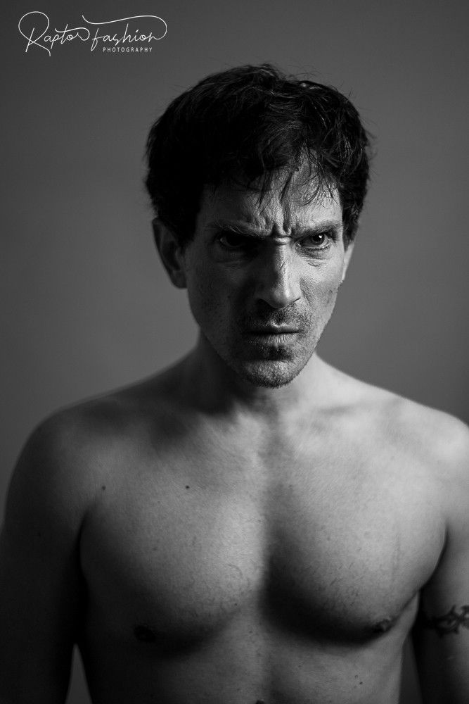 A dramatic black and white portrait series showing shirtless figure in moody lighting against dark background.