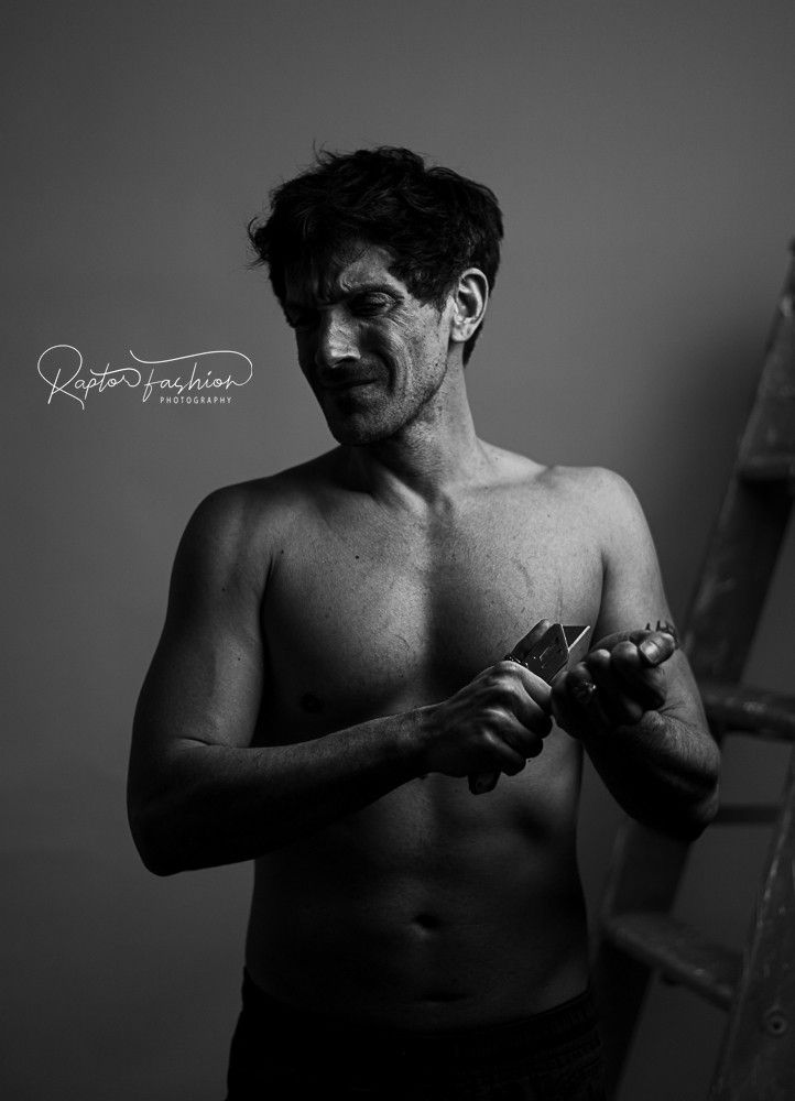 A dramatic black and white photo series showing a shirtless boxer in various fighting stances and poses.
