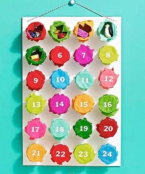 Advent calendar with 24 numbered bottle cap style containers in bright colors against turquoise background.