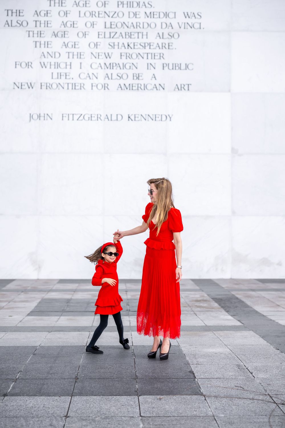 Elegant family photo session at the Kennedy Center in Washington, D.C., featuring stunning indoor chandeliers, panoramic