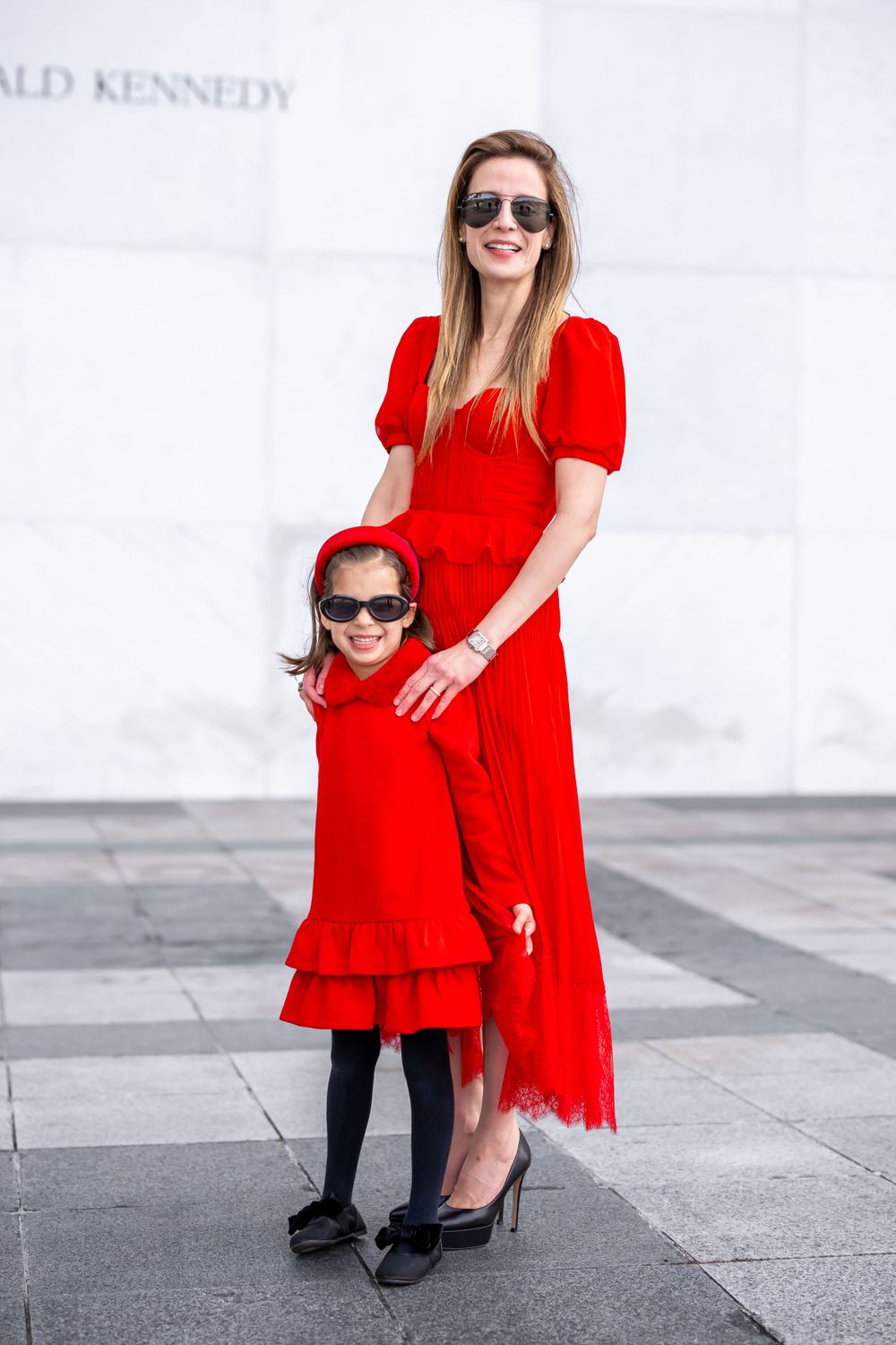 Elegant family photo session at the Kennedy Center in Washington, D.C., featuring stunning indoor chandeliers, panoramic