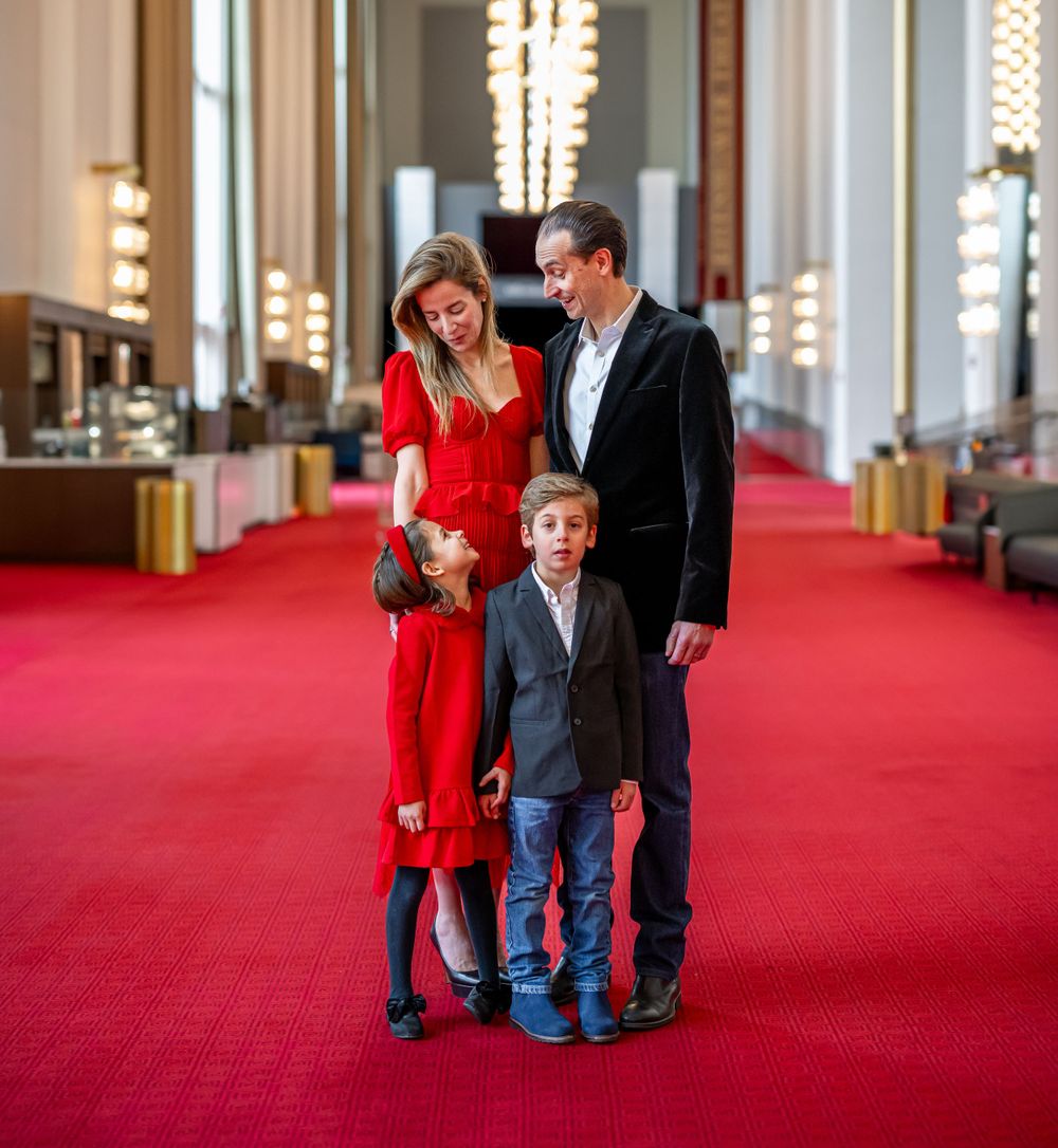 Elegant family photo session at the Kennedy Center in Washington, D.C., featuring stunning indoor chandeliers, panoramic