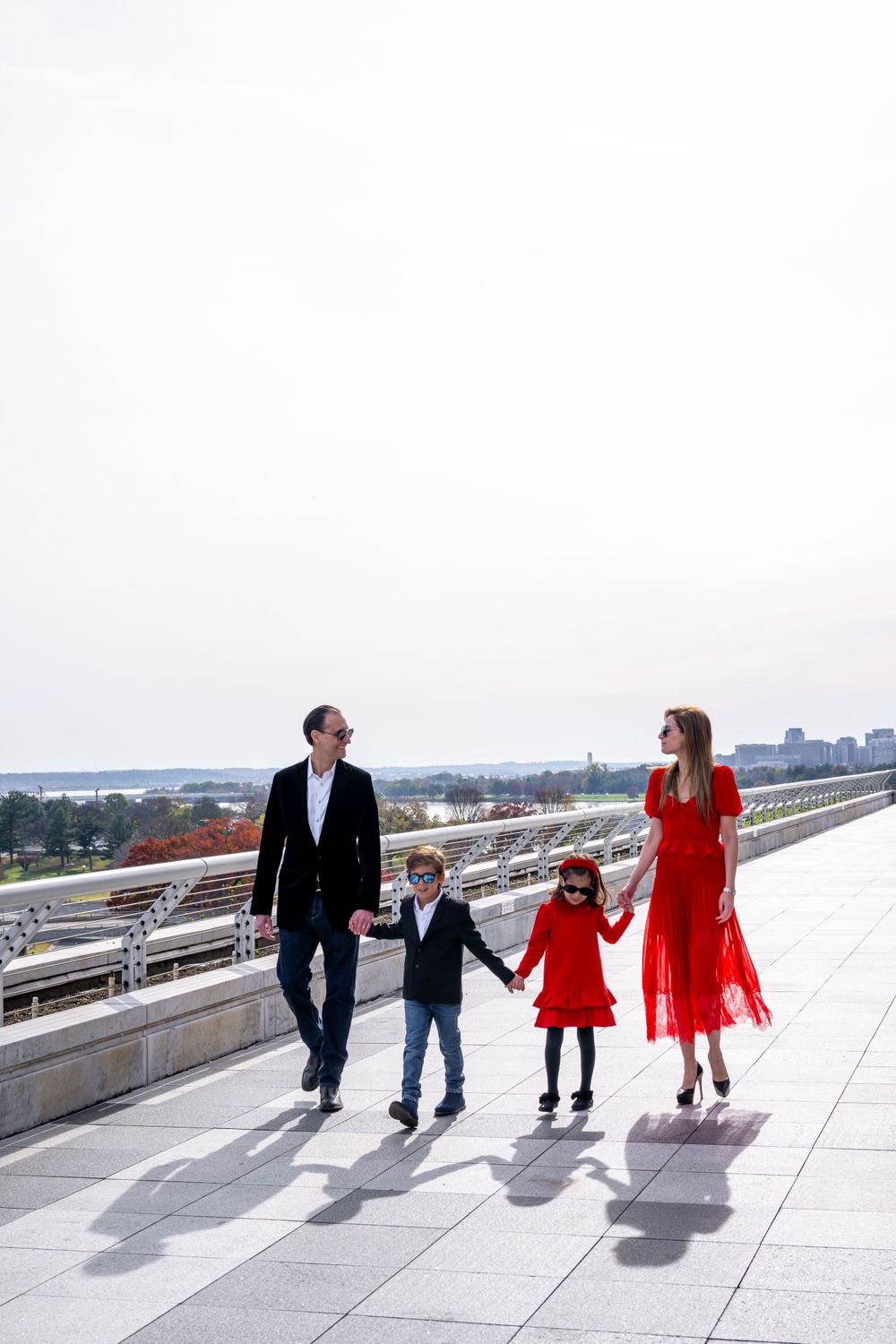 Elegant family photo session at the Kennedy Center in Washington, D.C., featuring stunning indoor chandeliers, panoramic