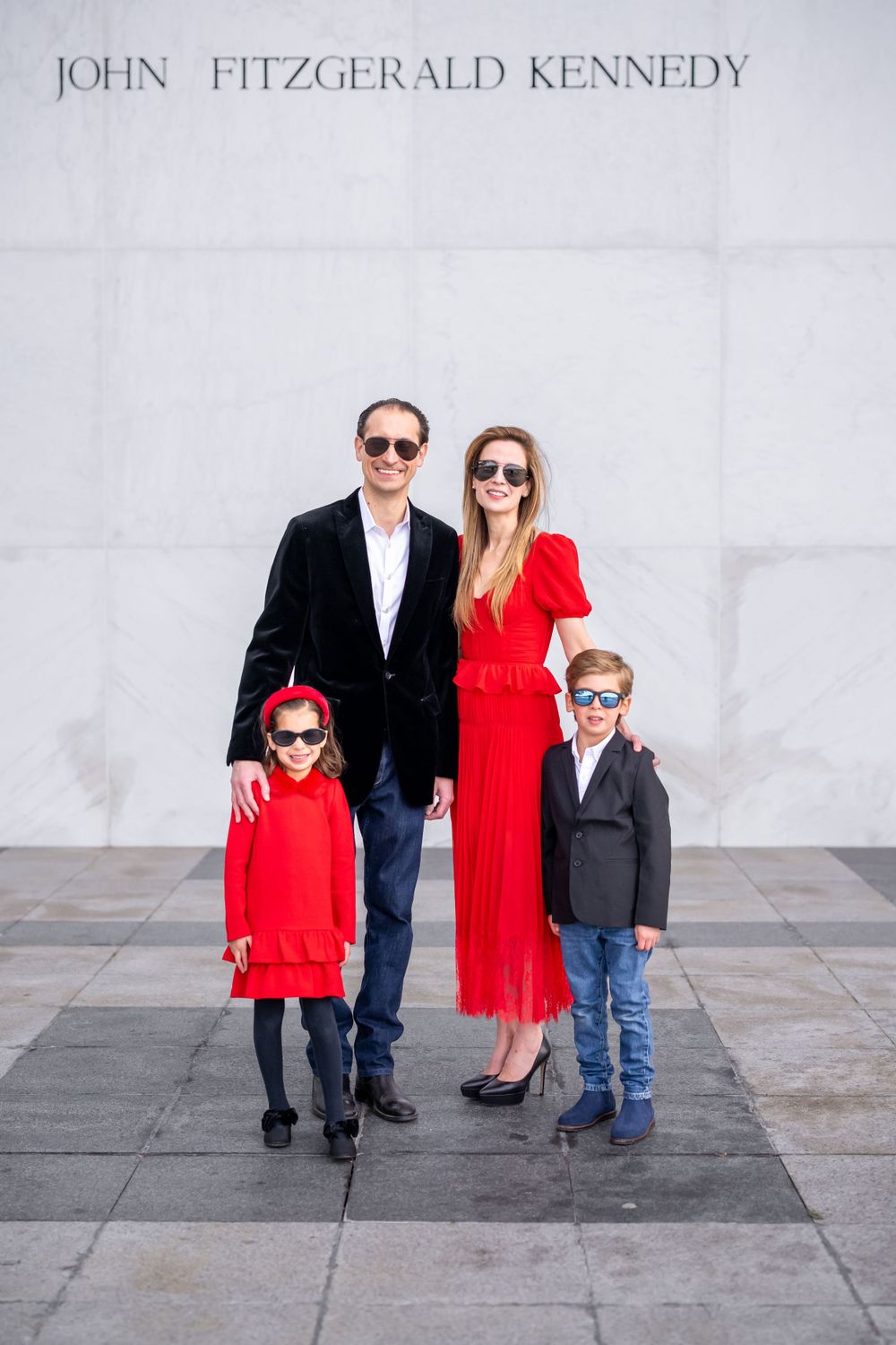 Elegant family photo session at the Kennedy Center in Washington, D.C., featuring stunning indoor chandeliers, panoramic