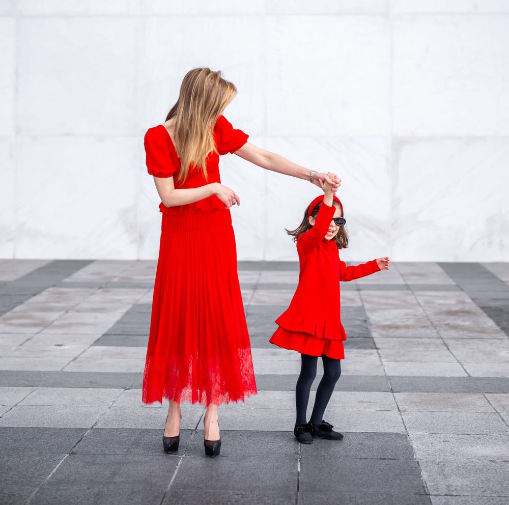 Elegant family photo session at the Kennedy Center in Washington, D.C., featuring stunning indoor chandeliers, panoramic