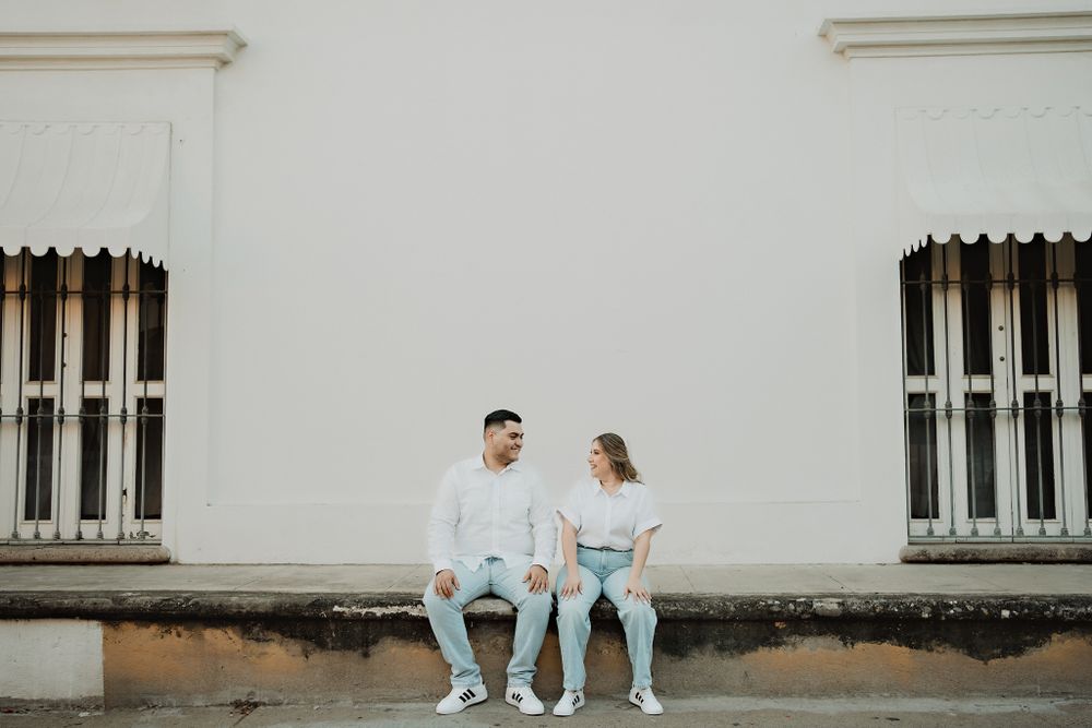 Sitting together, enjoying a quiet yet memorable moment during their Mazatlán pre-wedding session