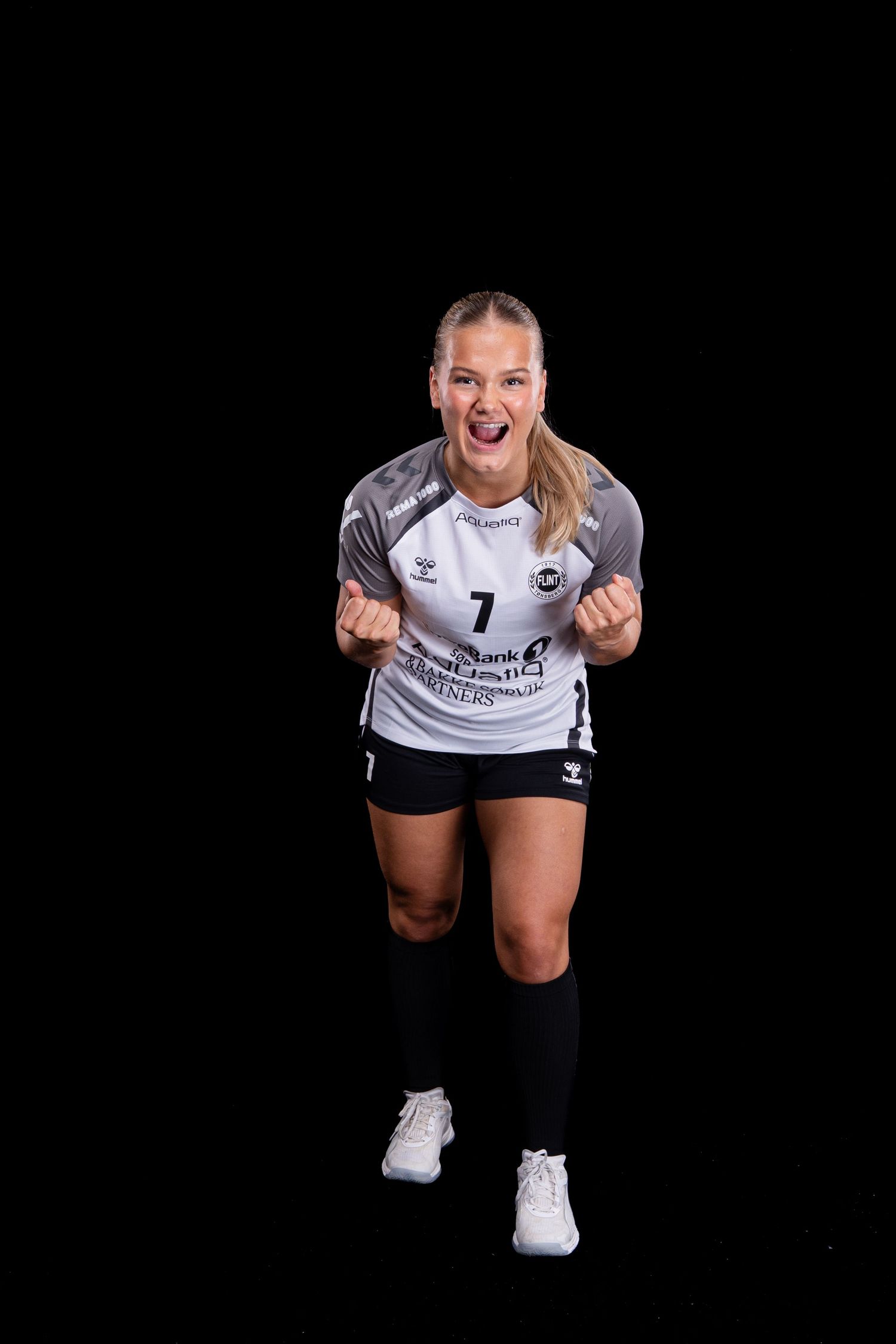 A female volleyball player in a white jersey poses expressively against a black background in a dynamic photo series.