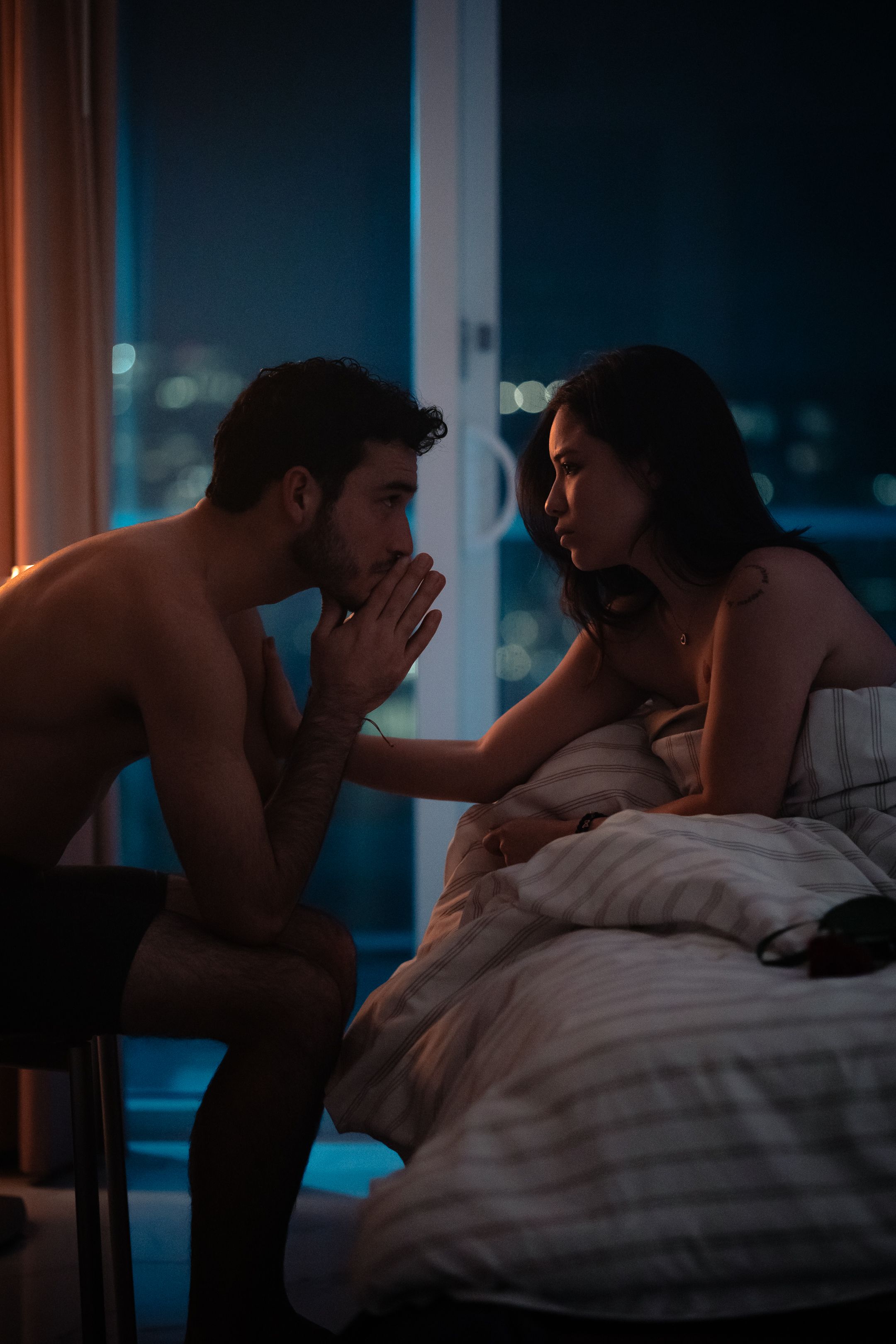 Moody South Florida editorial portrait with city skyline light, cinematic close-up styled for indie filmmakers by MannyPortraits.