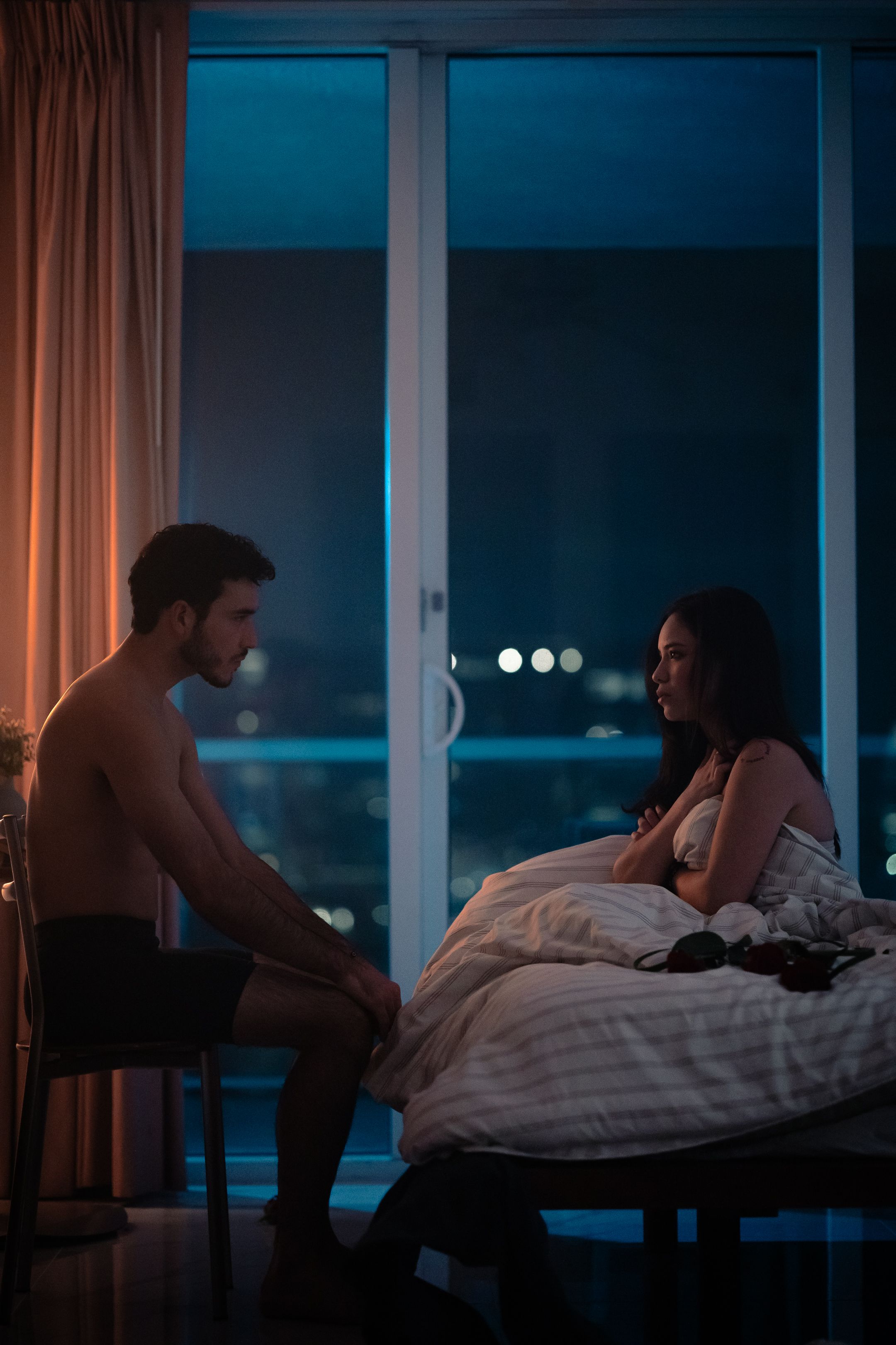 Intimate South Florida cinematic scene with couple in hotel room, dramatic lighting for acting school performers by MannyPortraits