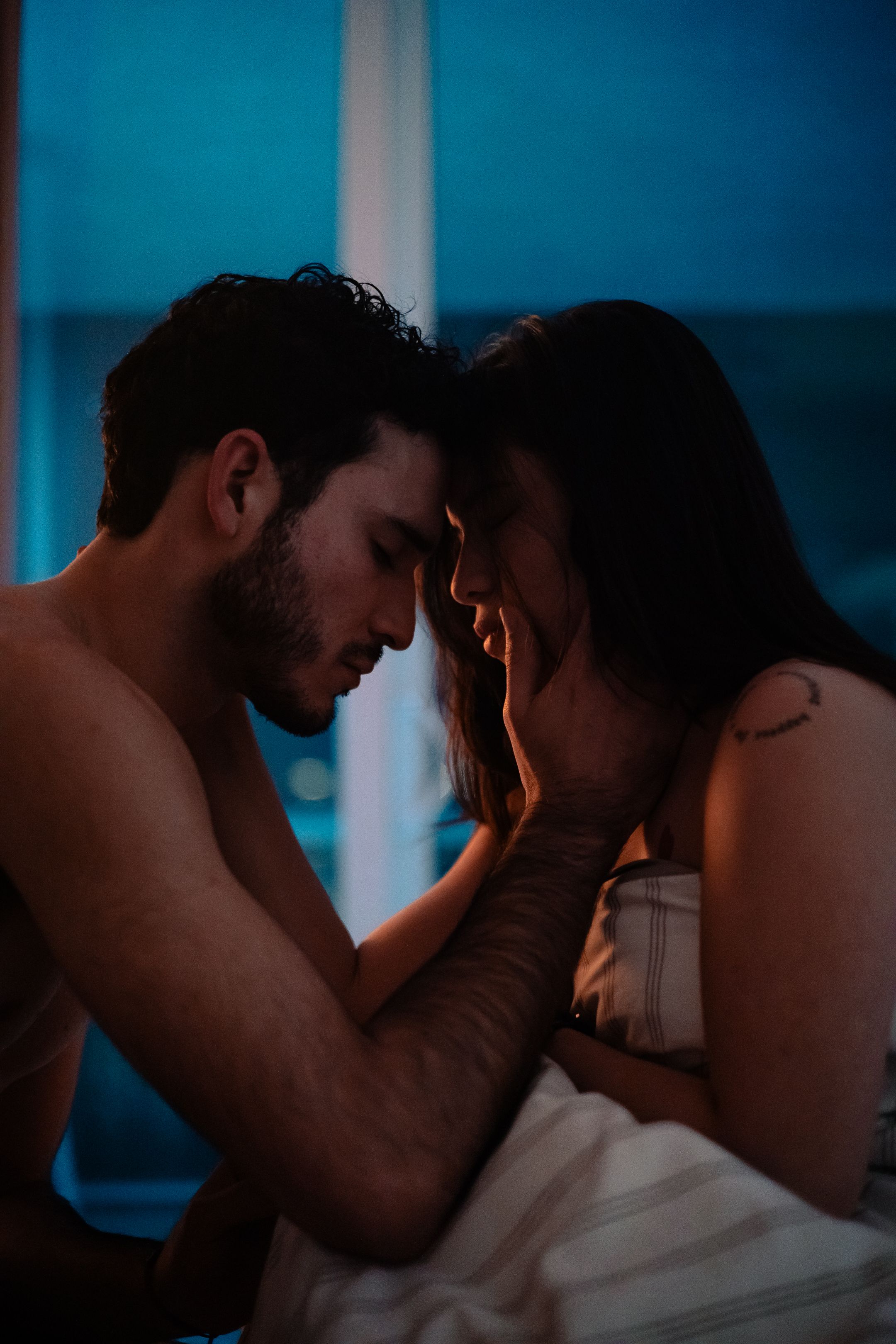Editorial South Florida couple portrait in moody cinematic blue tones, Netflix drama inspired photography by MannyPortraits.