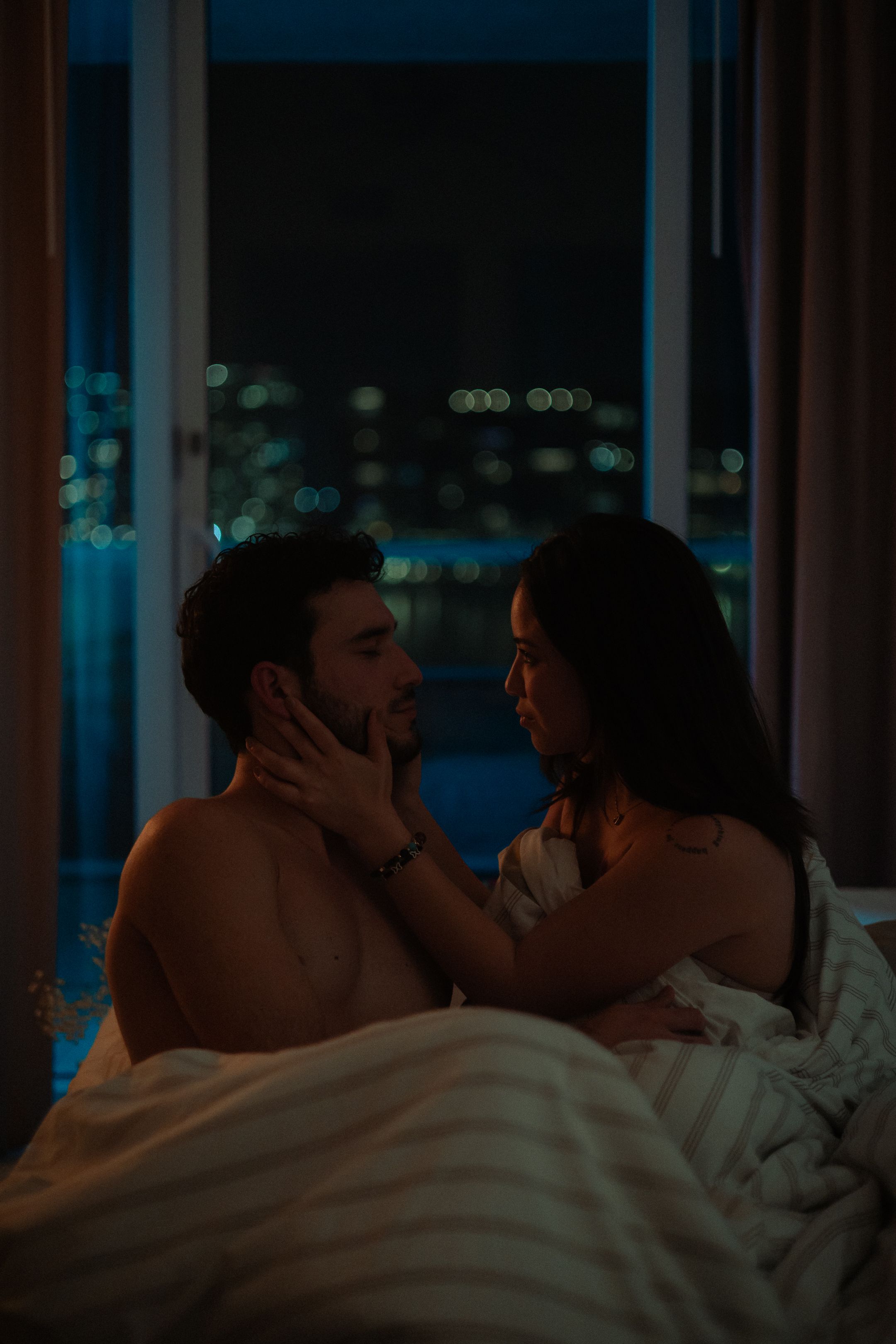 Cinematic Miami couple portrait in moody blue light, editorial photography styled for indie films and actors by MannyPortraits