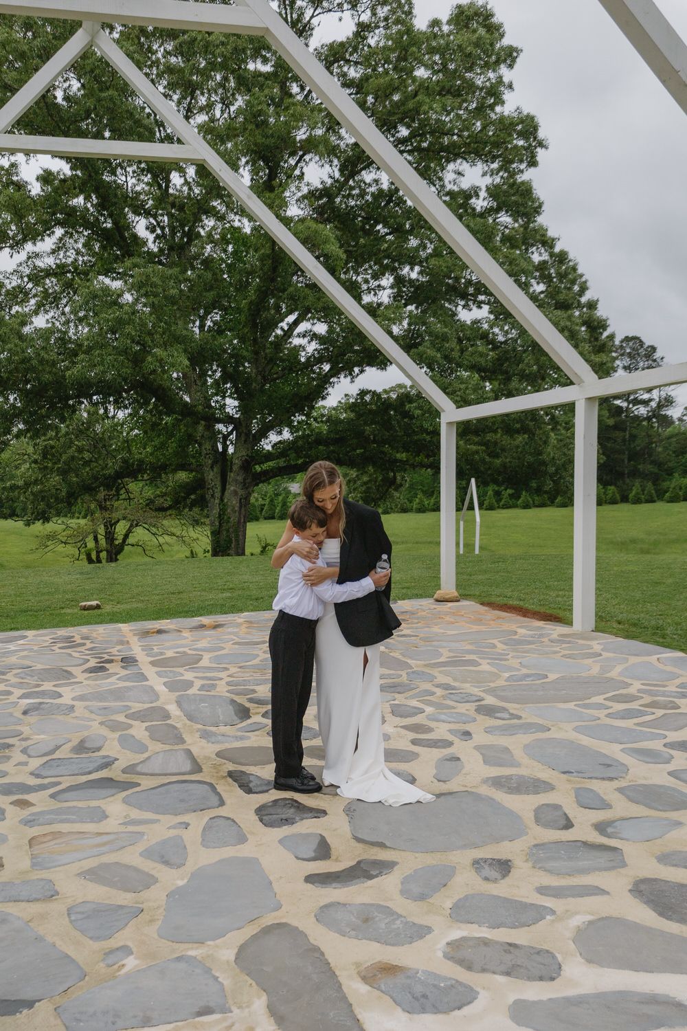 Bride having a sweet moment with her nephew on her georgia wedding day