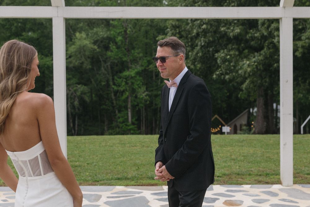 Bride's dad seeing her for the first time on her wedding day at the venue at twin oaks in bremen georgia