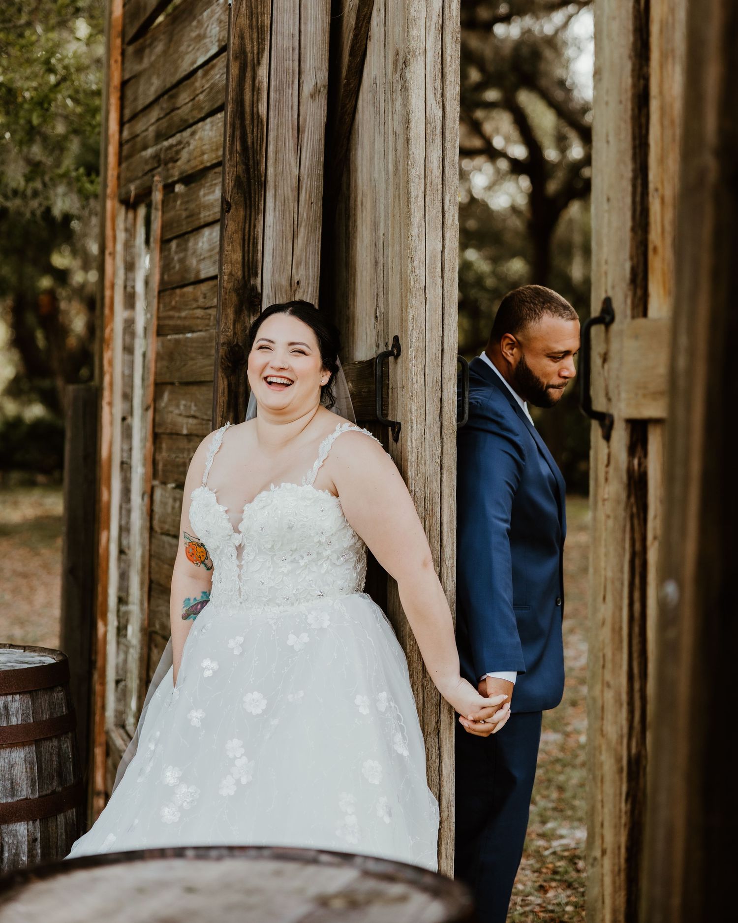 Rustic barn wedding first look sequence with couple sharing joyful moments.