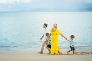 Maui family photographer photo against beautiful Maui sunrise beach by ohwowfotos.