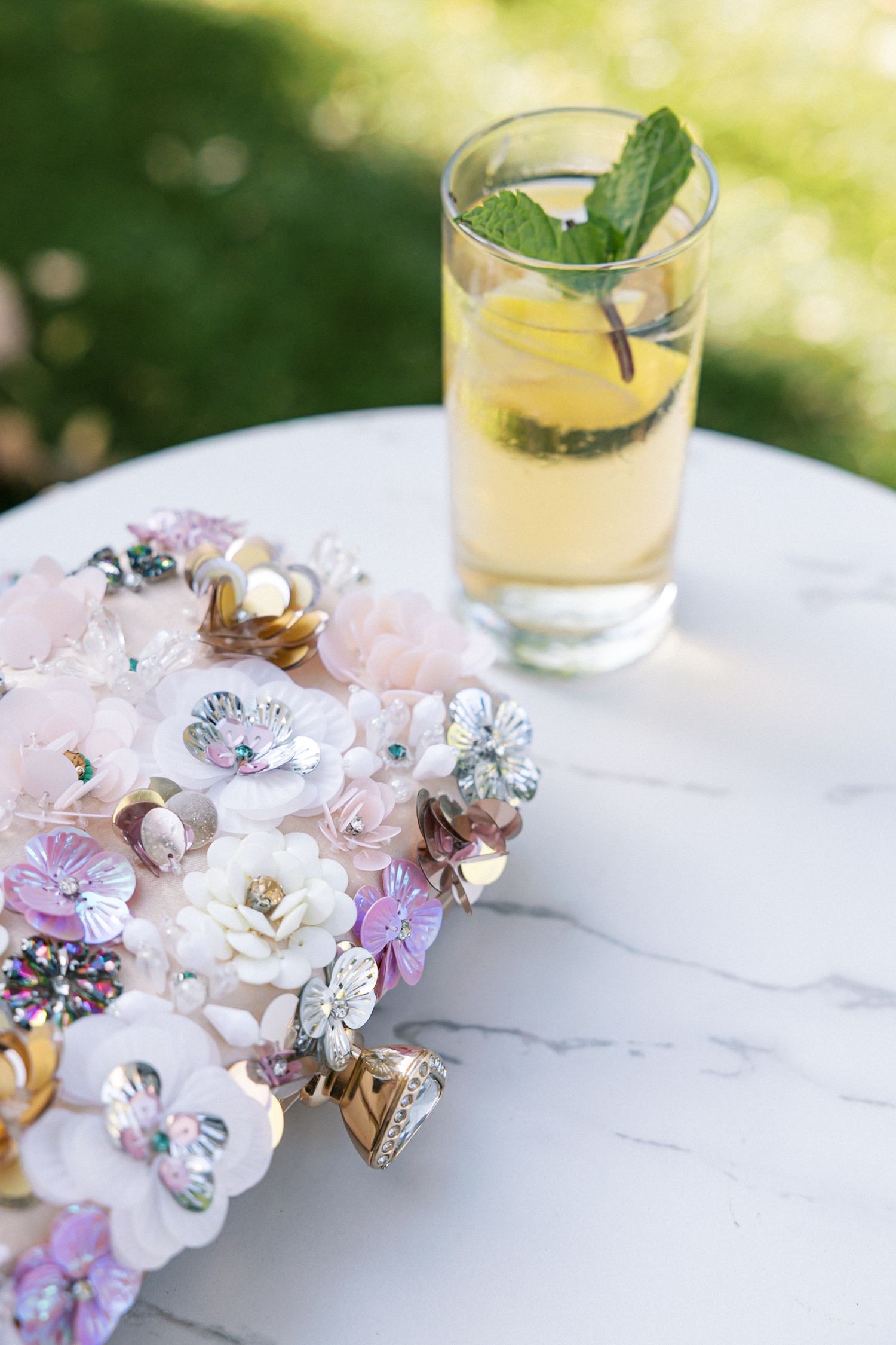 Fun wedding party detail: guest’s clutch bag and drink at Quinta do Torneiro celebration