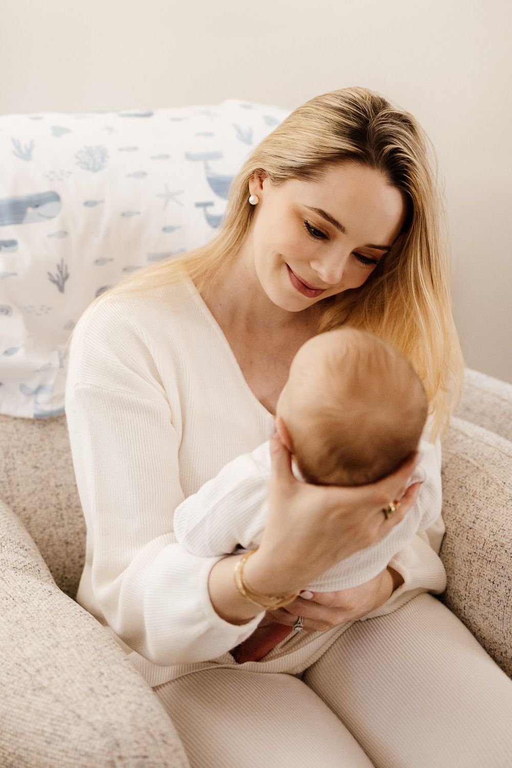 A mother holds her newborn baby during her baby photoshoot in the Bay Area