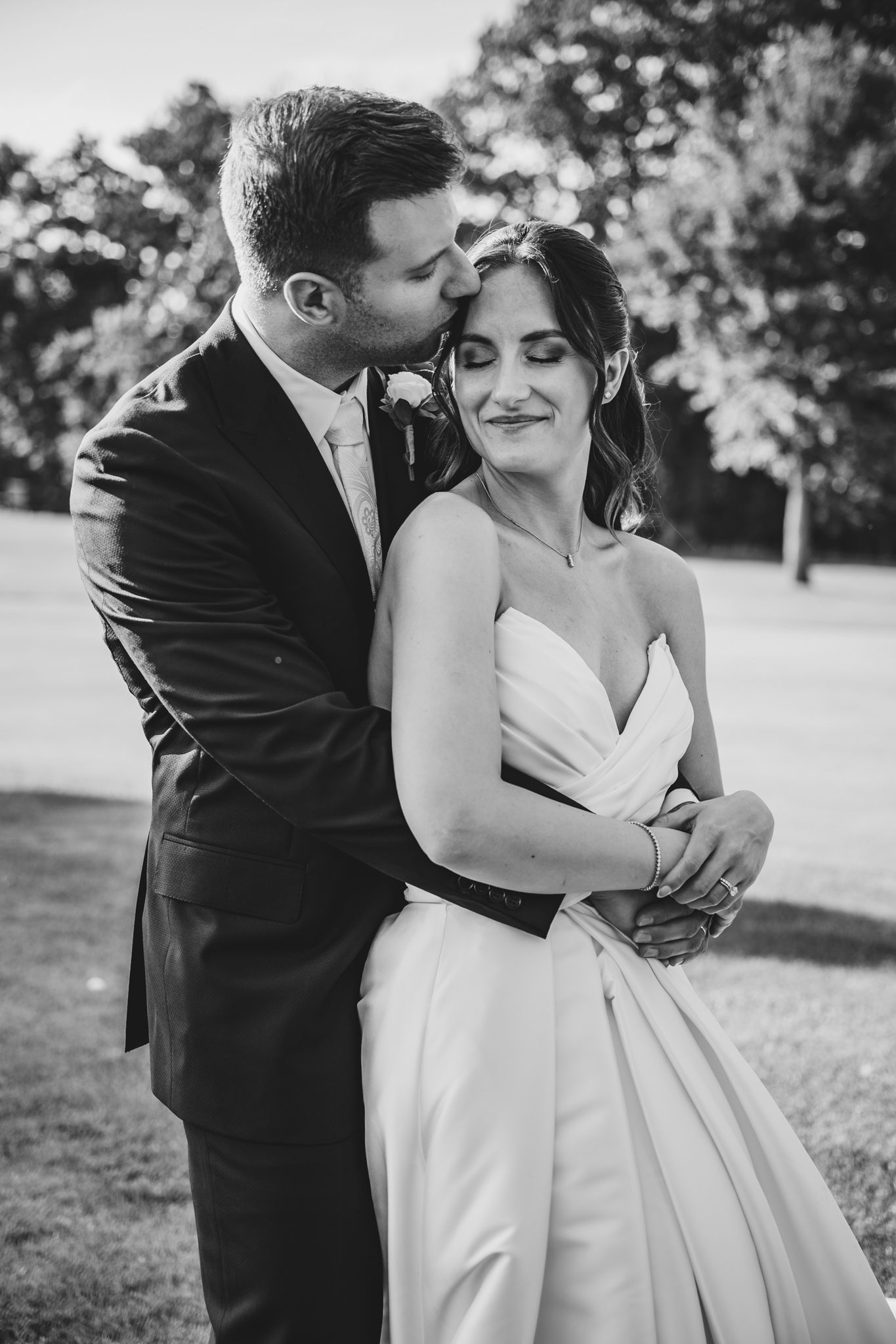 Black and white intimate wedding portraits showing tender moments between newlyweds.