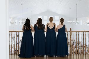 Bridesmaids overlook the Grand Ivory wedding venue while getting ready during fall October wedding in Moncton New Brunswick wedding photos